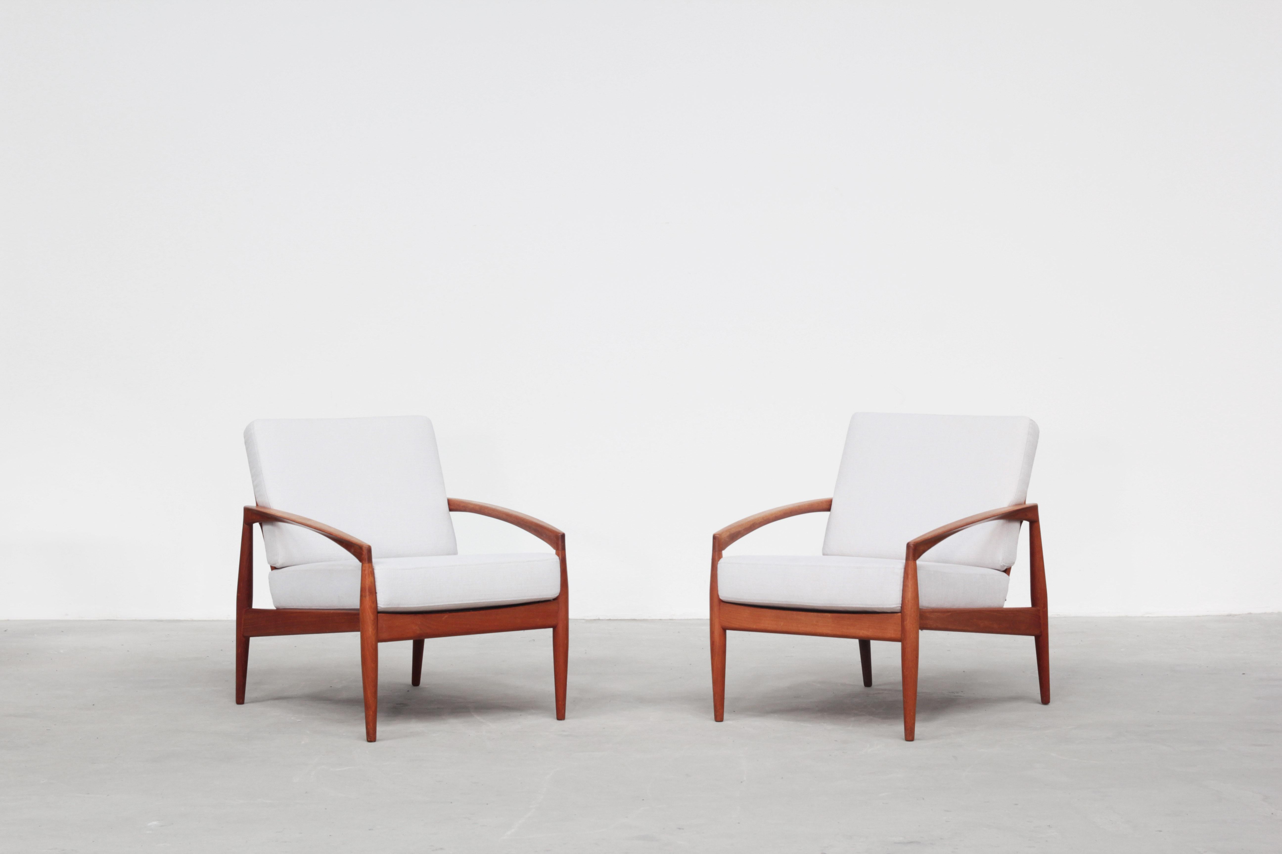 A pair of lounge chairs mod. Paperknife by Kai Kristiansen for Magnus Olesen. Both chairs are in excellent condition with just minimal signs of use. The frame is made out of teak wood and the cushions were newly covered with high-quality fabric in