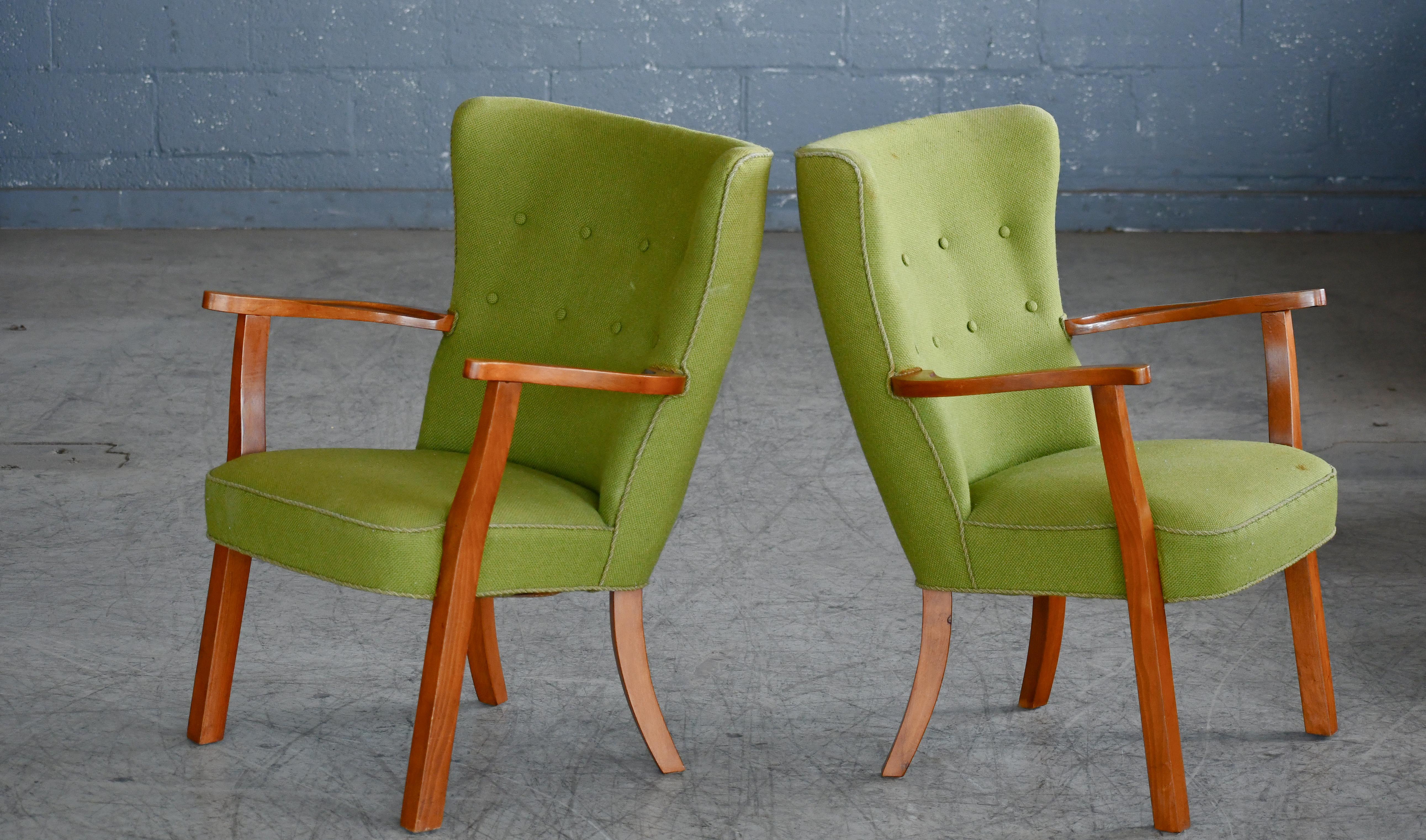 Scandinavian Modern Pair of Danish Lounge or Armchairs with Teak legs and Armrests, 1950's. For Sale