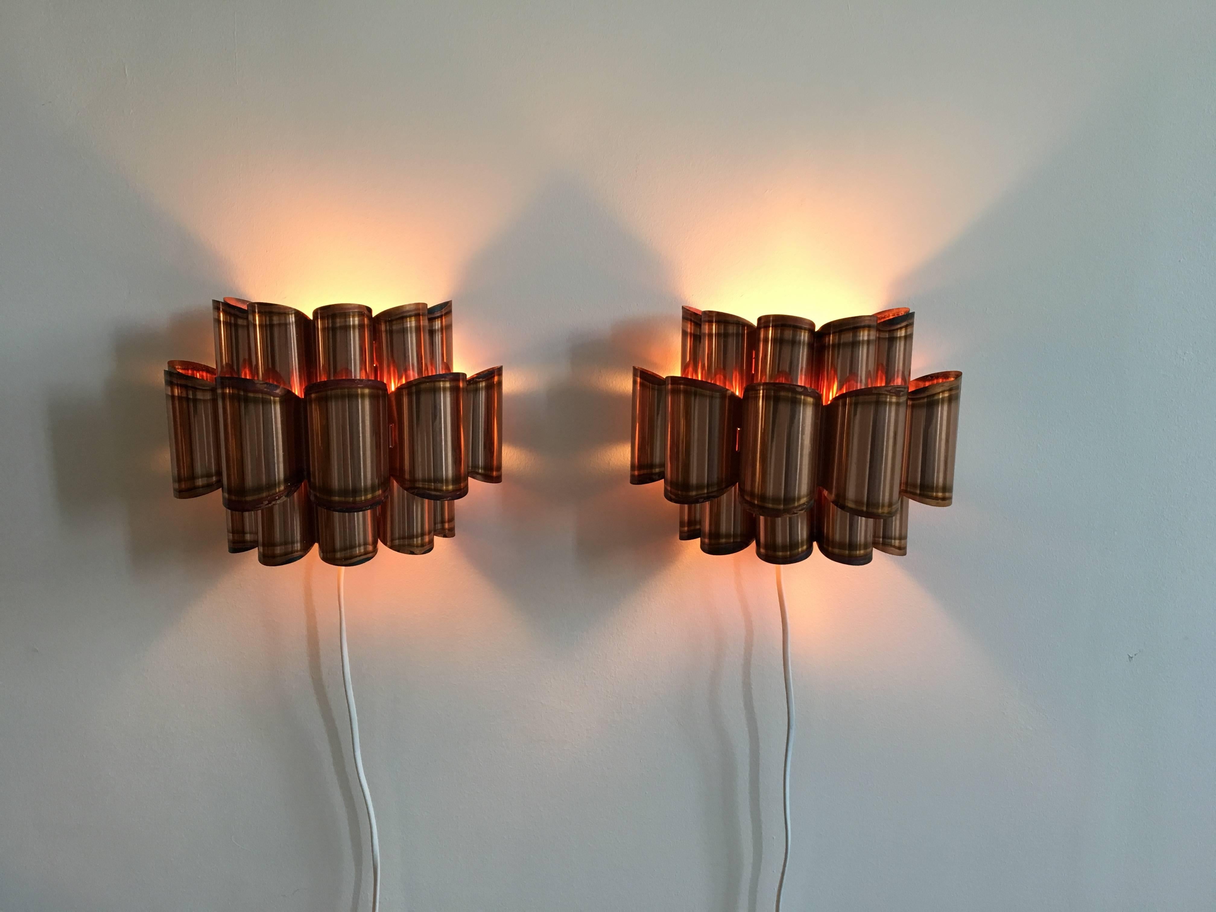 Beautiful pair of sconces or wall lights from the 1960s by Verner Schou. The scones have the form of wabes and the reflection of the light in the copper wabe structure creates a wonderful light effect. The sconces are in very good condition. One E14