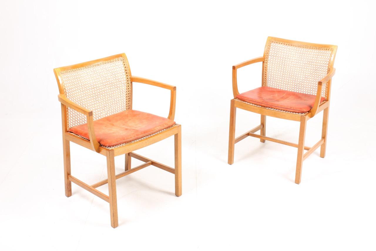 Scandinavian Modern Pair of Danish Midcentury Armchairs in Mahogany and Patinated Leather For Sale