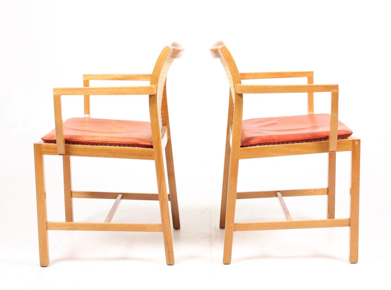 Mid-20th Century Pair of Danish Midcentury Armchairs in Mahogany and Patinated Leather For Sale