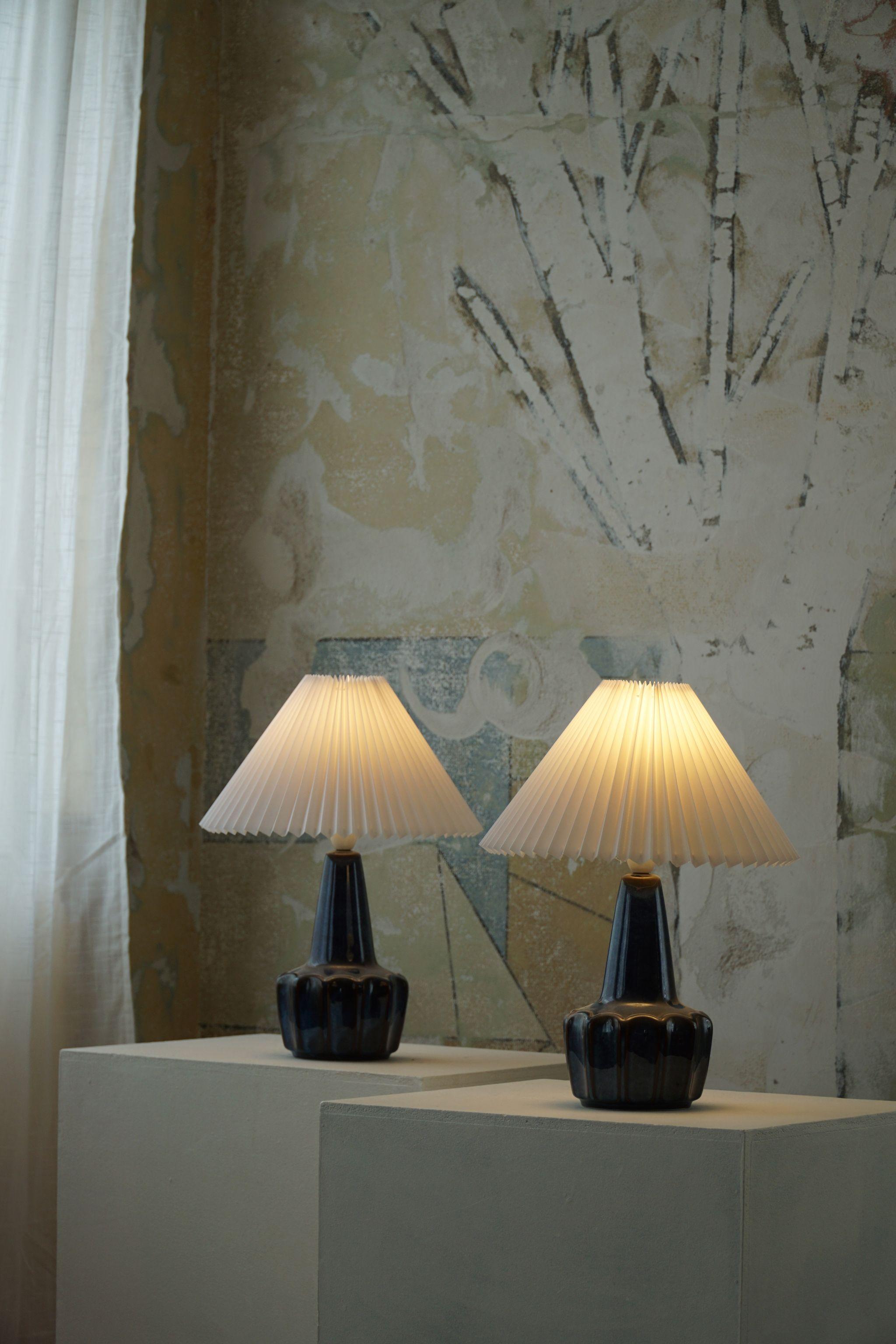 A beautiful pair of ceramic table lamps with a luxurious clam glaze. Produced at Søholm Ceramic fabric in 1960s. Denmark. Marked underneath.

Both table lamps are in a mint condition, newly rewired. 

