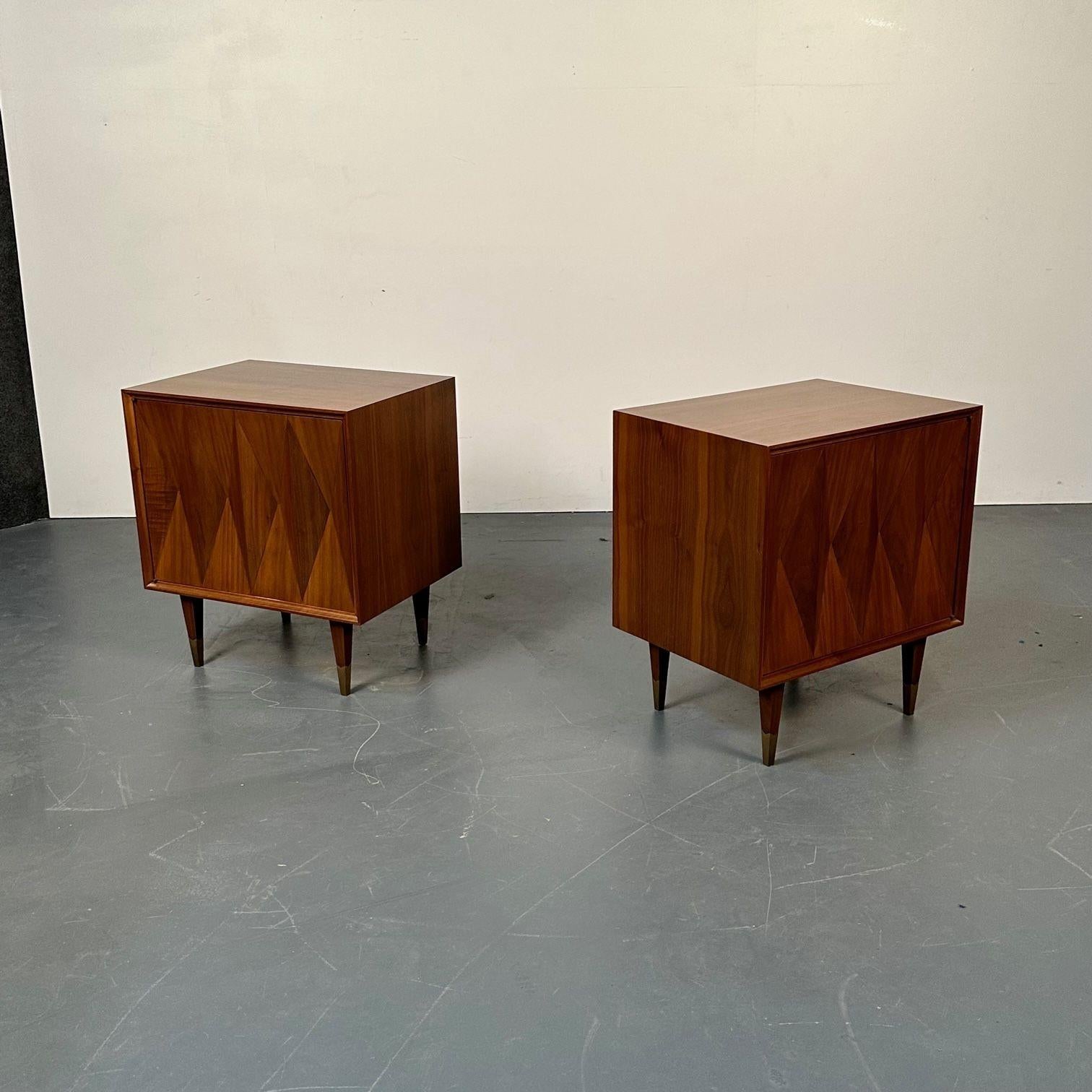Pair of Danish Mid-Century Modern style Geometric Nightstands, walnut, brass
 
A finely polished Mid Century pair of bedside stands each having a geometric shaped front. 
 
Walnut, Brass
United States, 2000s
 
Measures: 24.25H x 21W x 16D 
