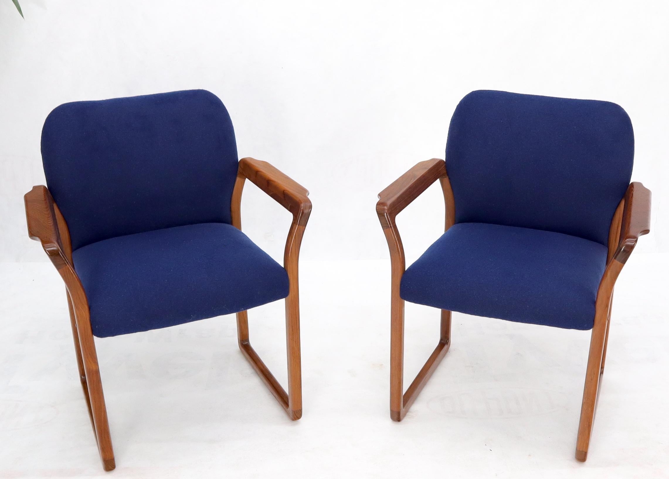 Danish Mid-Century Modern blue wool upholstery teak armchairs.