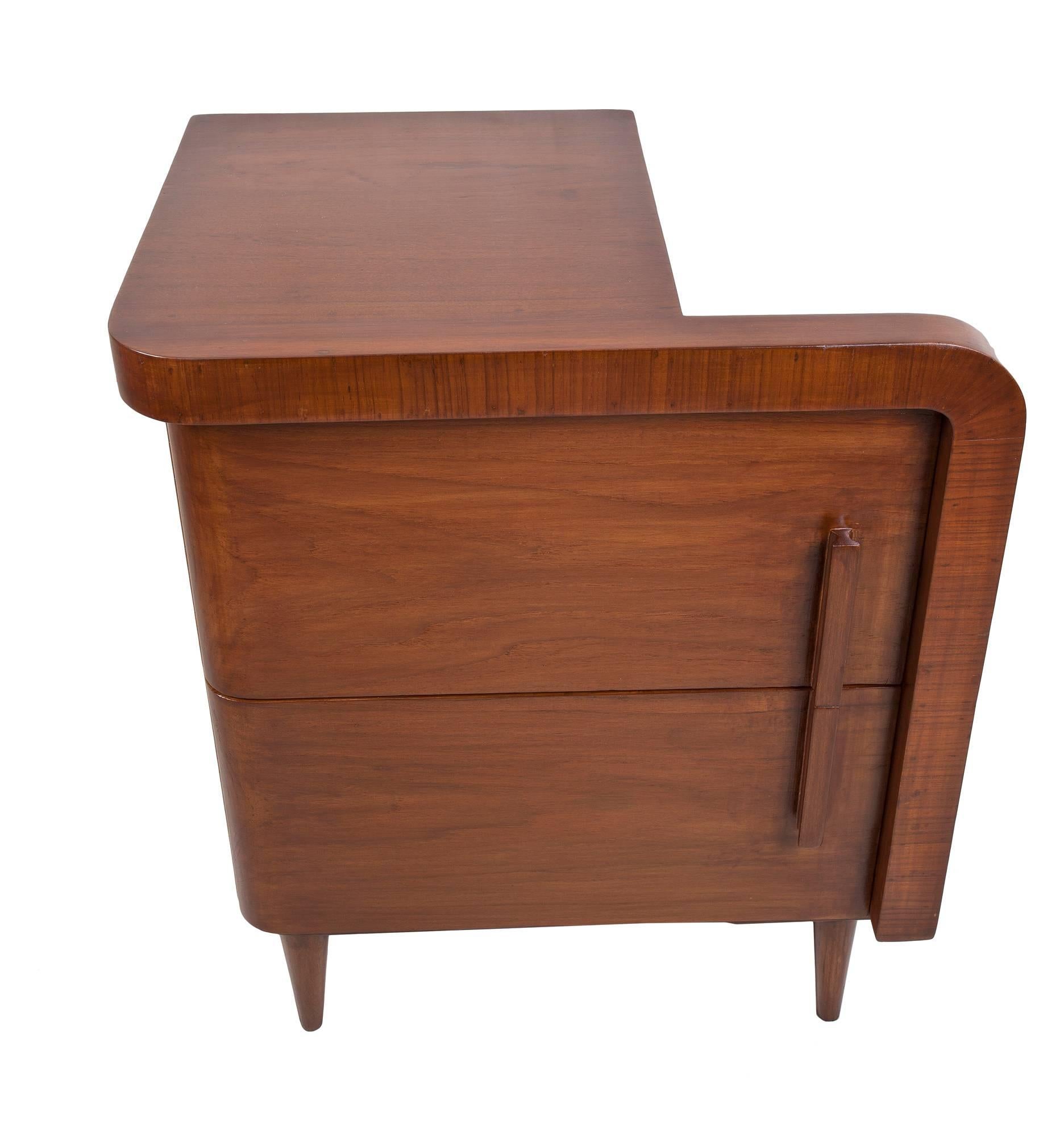 An unusual pair of Mid-Century Modern teak side tables with swing-out door fronts, Danish. Maker unknown. A very cool double drawer swing-out mechanism.