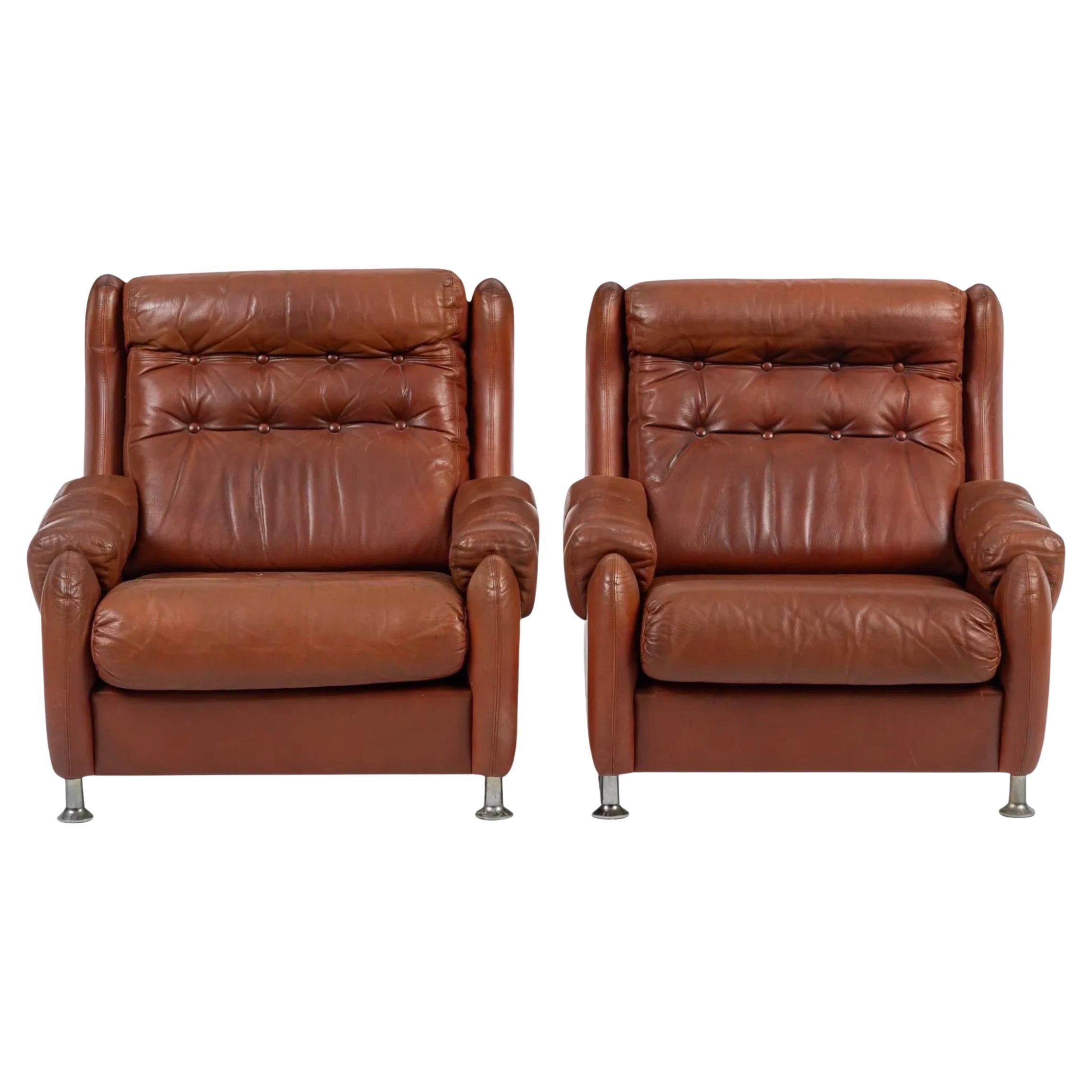 Pair of Danish mid century modern tufted brown leather lounge chairs