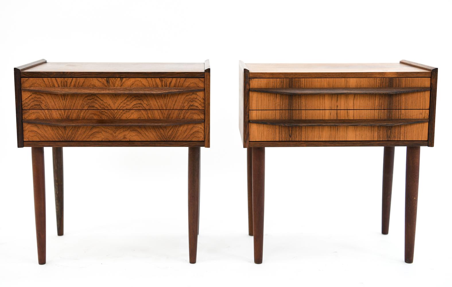 This is a handsome pair of Danish midcentury rosewood nightstands, circa 1960s. These side tables feature clean, modern lines with recessed handles. A classic example of Scandinavian design.
 