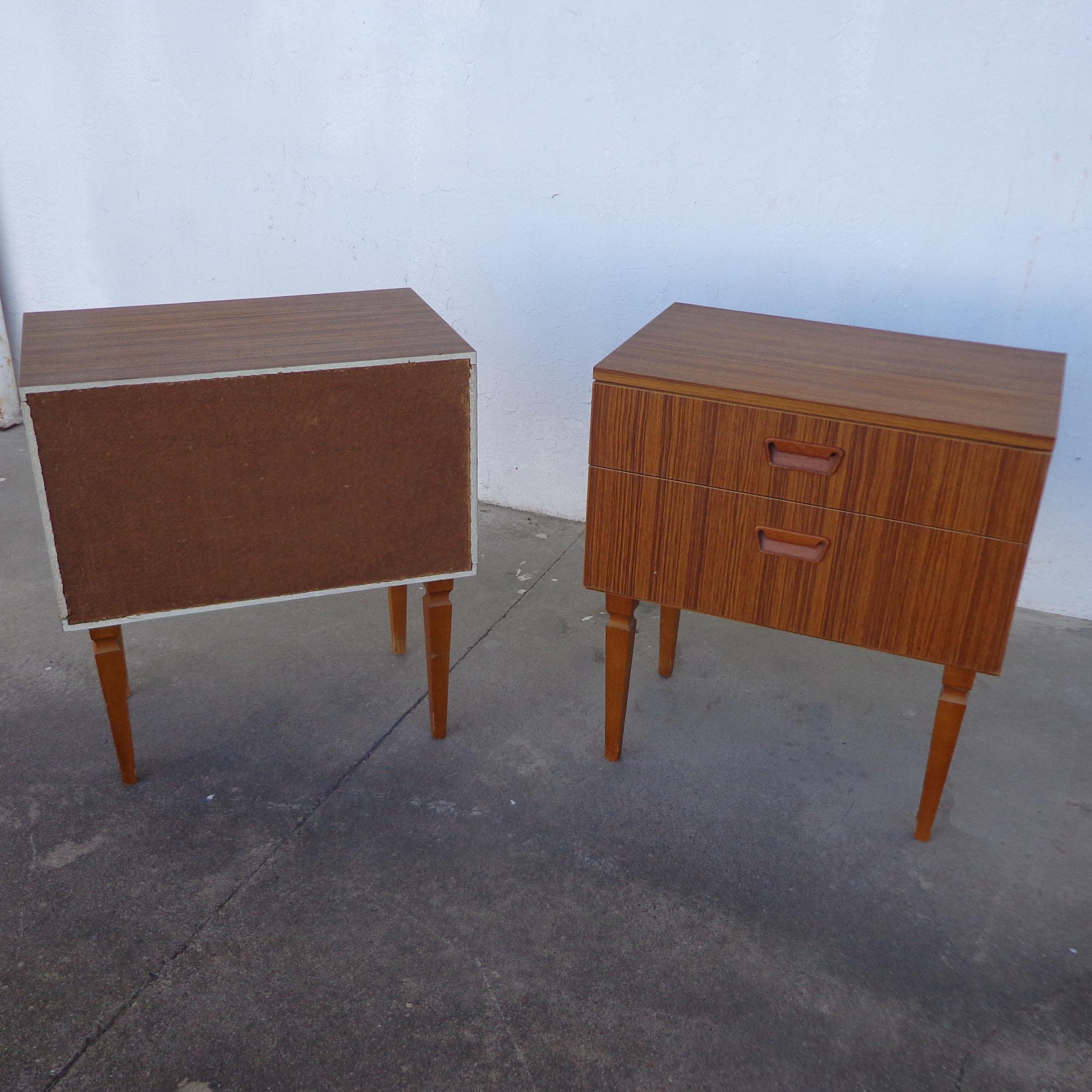Pair of mid century teak nightstands

Mid century pair of bedside tables in teak made in Europe. Each nightstand includes two drawers
with inset handles. Price is for the pair.


22