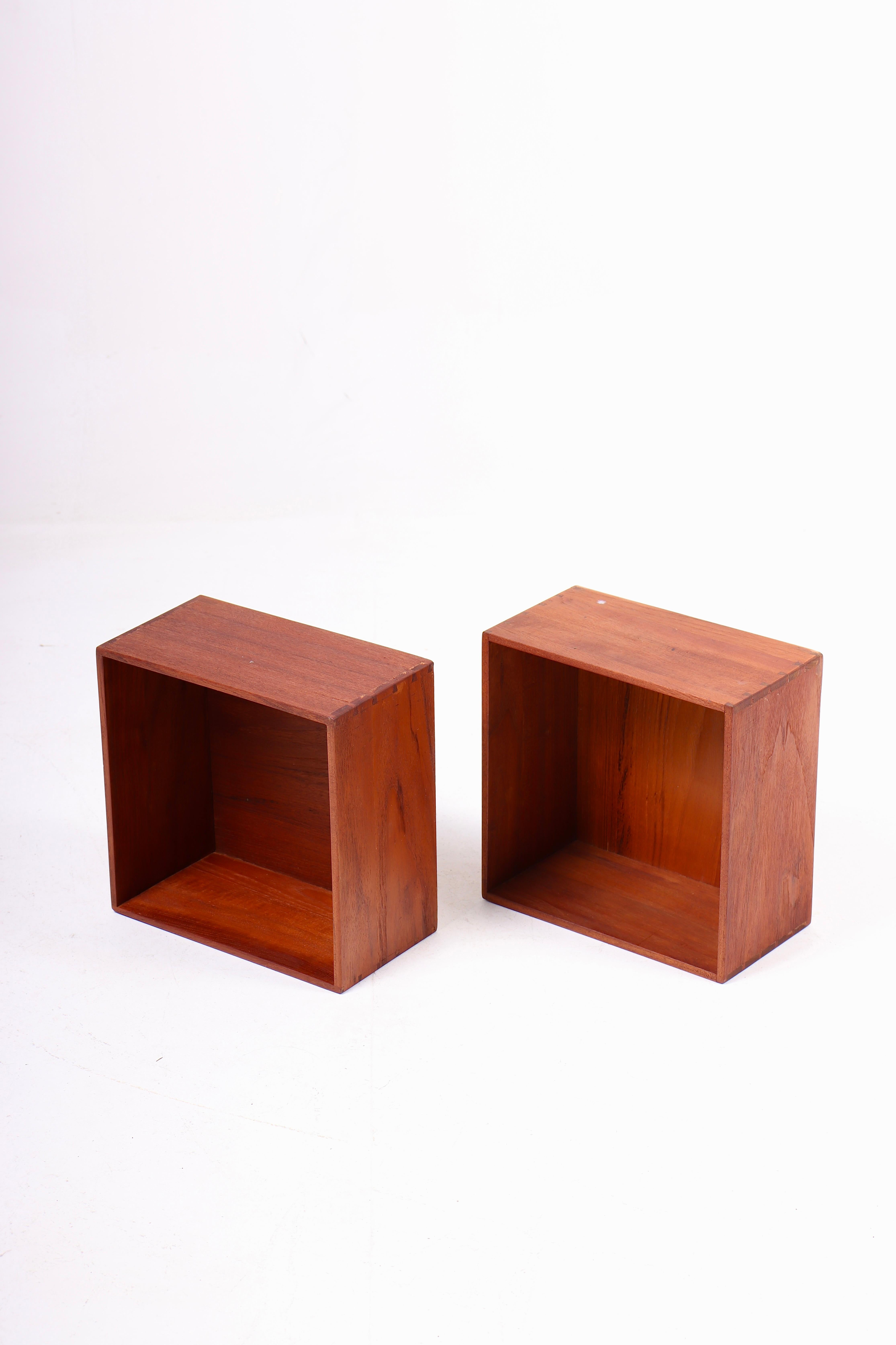 Pair wall-mounted bookcases in solid teak. Designed and made in Denmark. Great original condition.