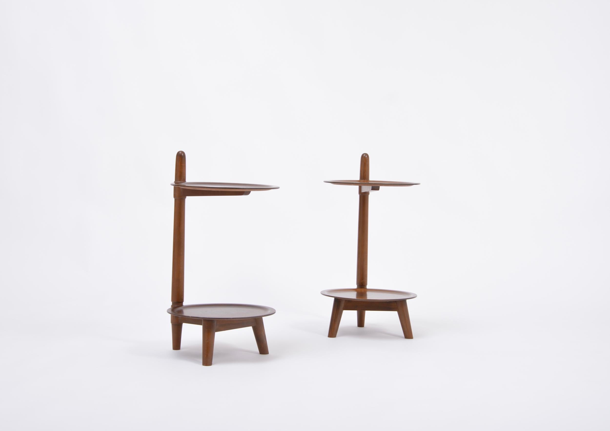 Pair of two tier side tables produced by Edmund Jørgensen in Denmark, probably in the 1950s. Each table has two circular shelves made of veneered walnut, the frames are made of stained beech wood. Appears with age-related signs of use. One table is