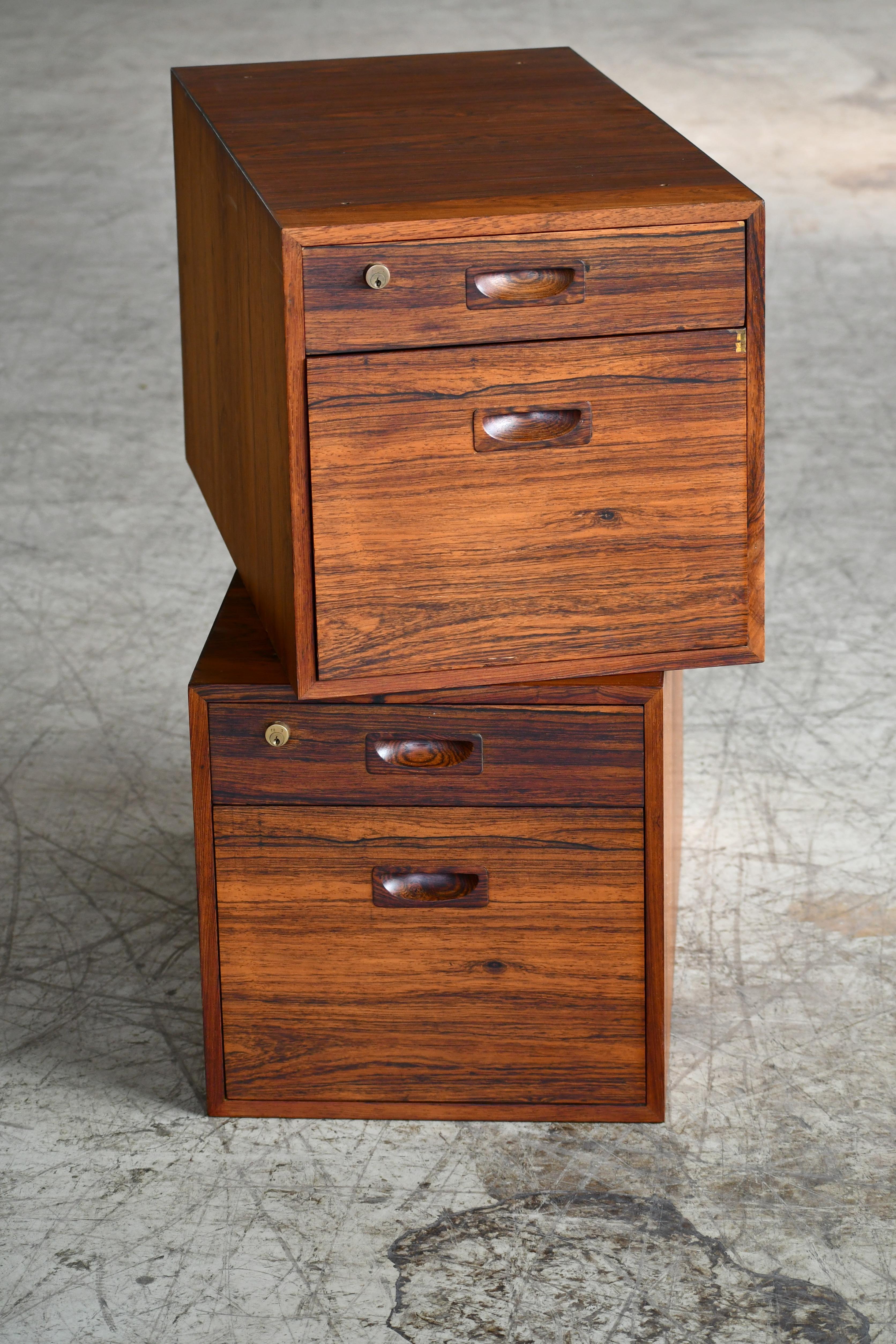 Beautiful pair of file cabinets in rosewood deigned by Arne Vodder and made in Denmark in the 1950s. The two cabinets were originally the drawer sections of a Arne Vodder desk, however, they have been separated from the desk at some point. In their