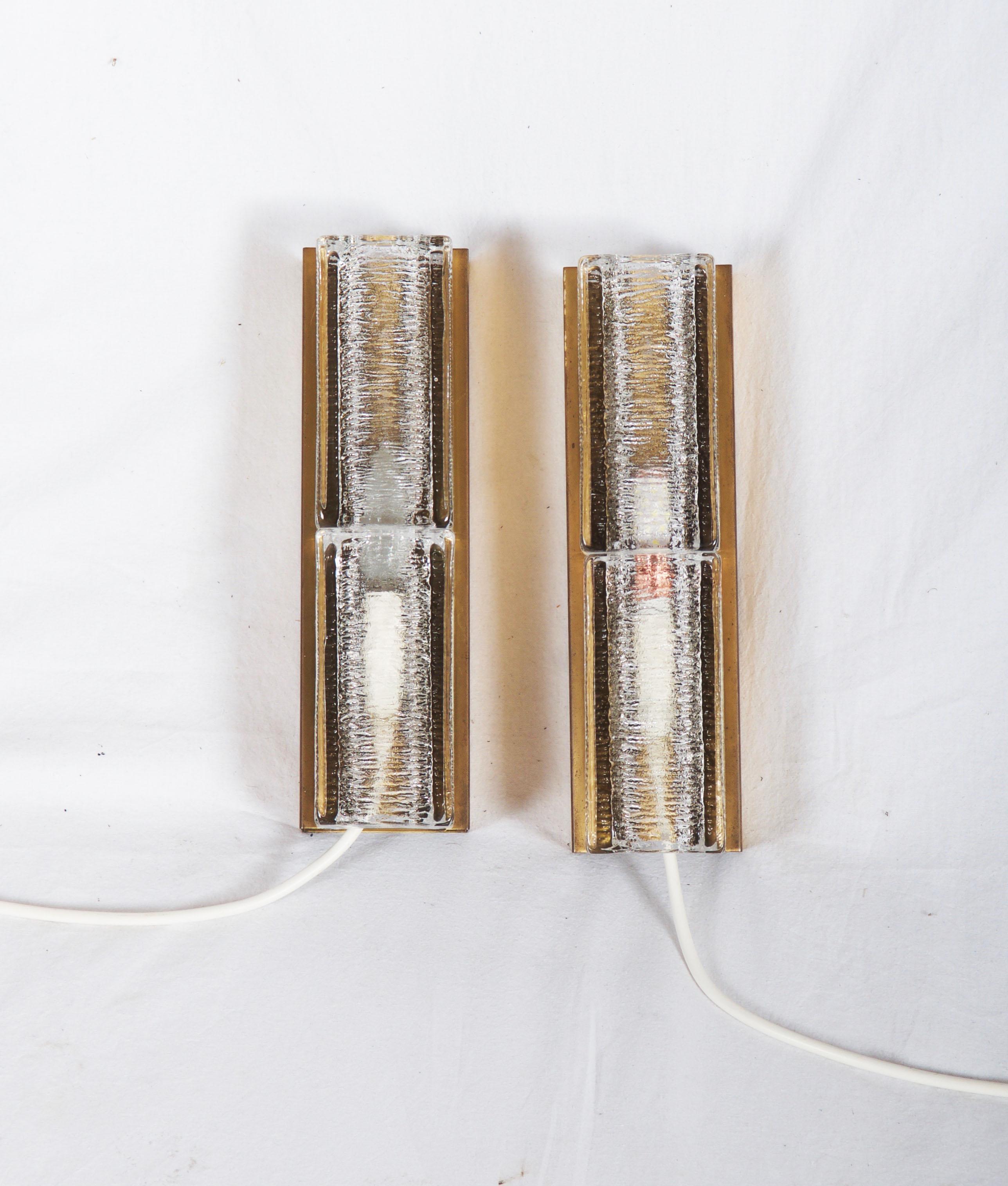 Brass construction with pressed glasses elements, fitted with one E14 socket, made in Denmark in the 1960s. Used but still in perfect condition. Price for a pair.
