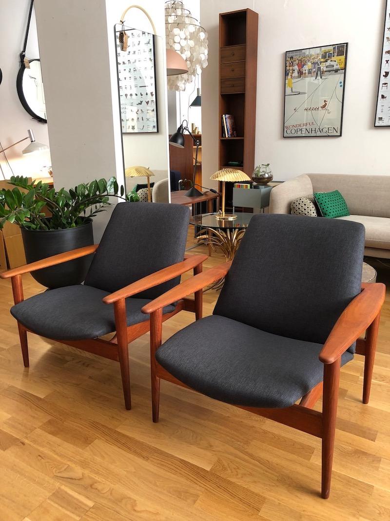 Pair of rare Danish teak chairs from the 1960s. Solid teak, new fabric cover. Simple and elegant shape. The teak wood frame was newly sanded and oiled. Marked with Made in Denmark.