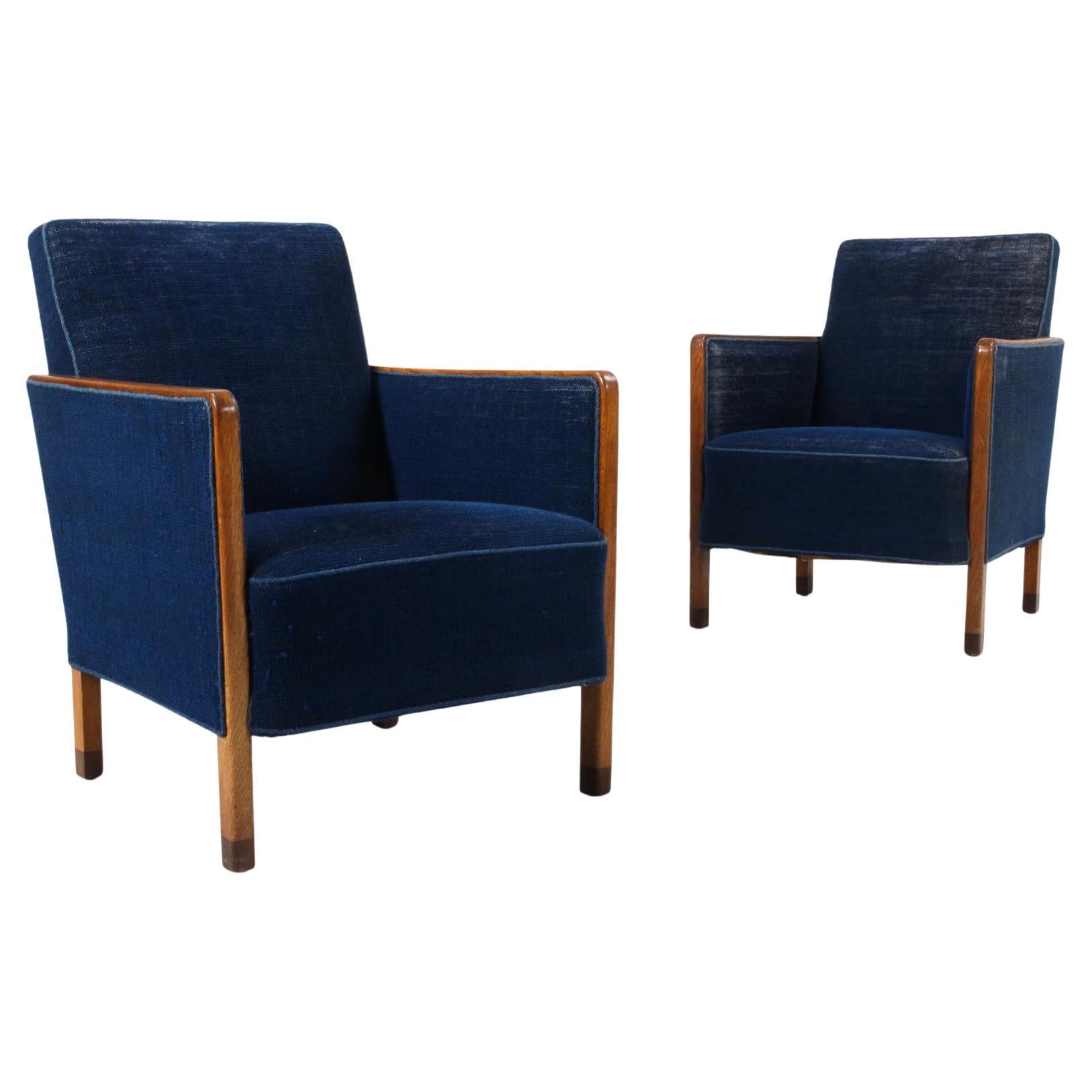 Paire de chaises longues danoises du milieu du siècle avec châssis et pieds en Oak en vente