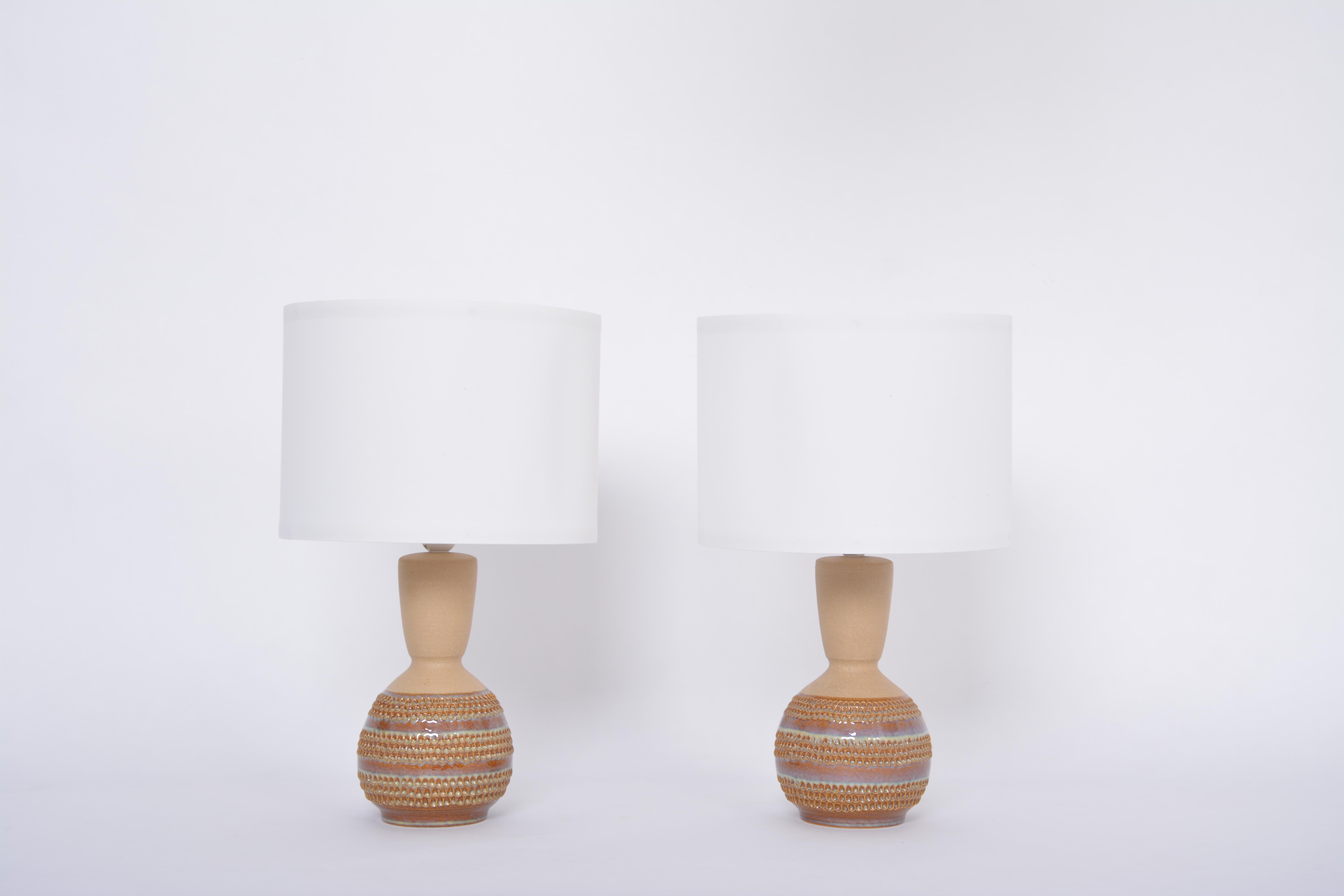 Pair of Danish Mid-Century Modern Ceramic table lamps model 3038 by Soholm
This pair of ceramic table lamps was produced by Soholm Stentoj in Denmark in the 1970s. Gorgeous handmade lamp bases of round shapes with long conic necks. The bases have a