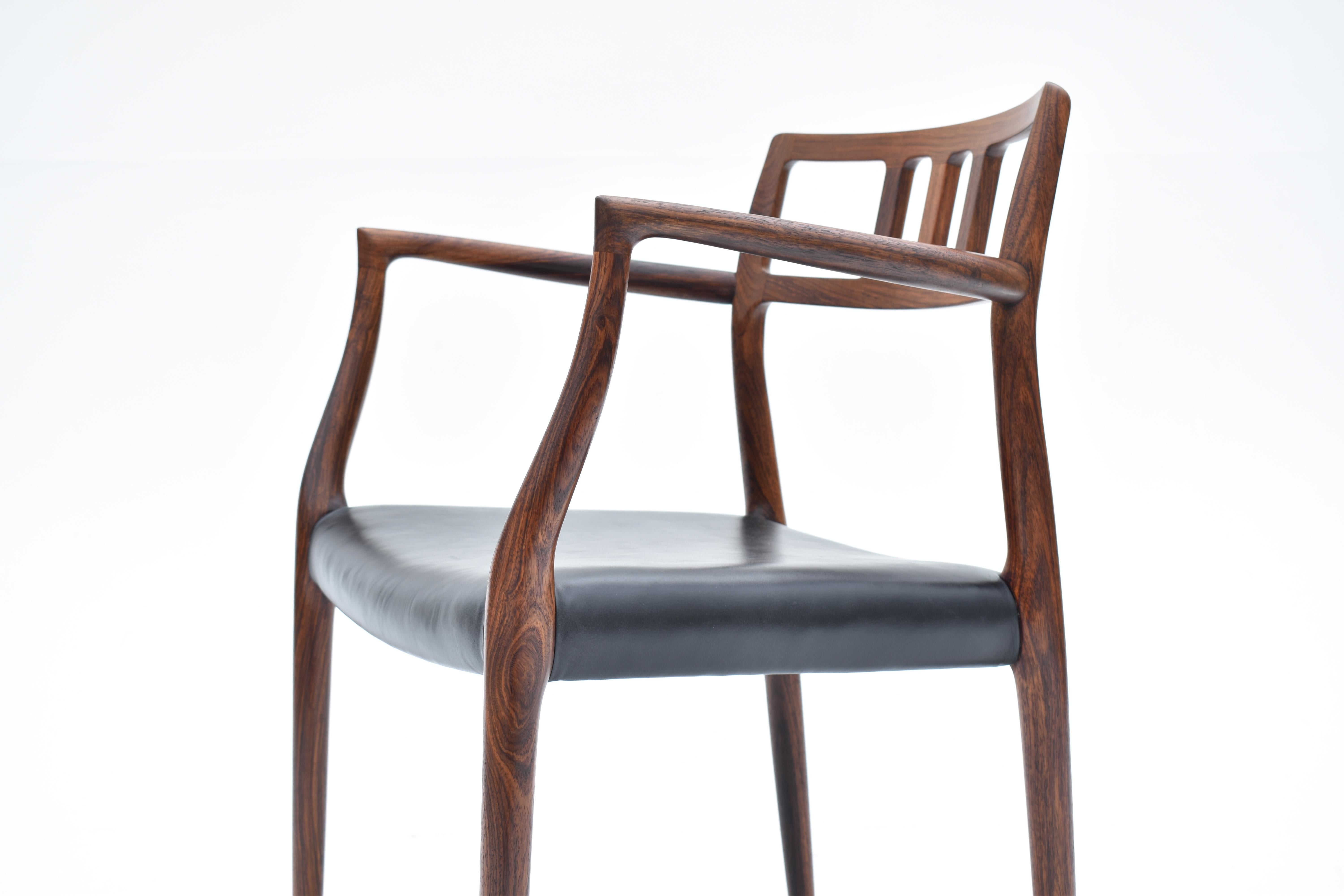 Paire de fauteuils danois du milieu du siècle en palissandre modèle 64 de Niels Møller, 1966 en vente 9