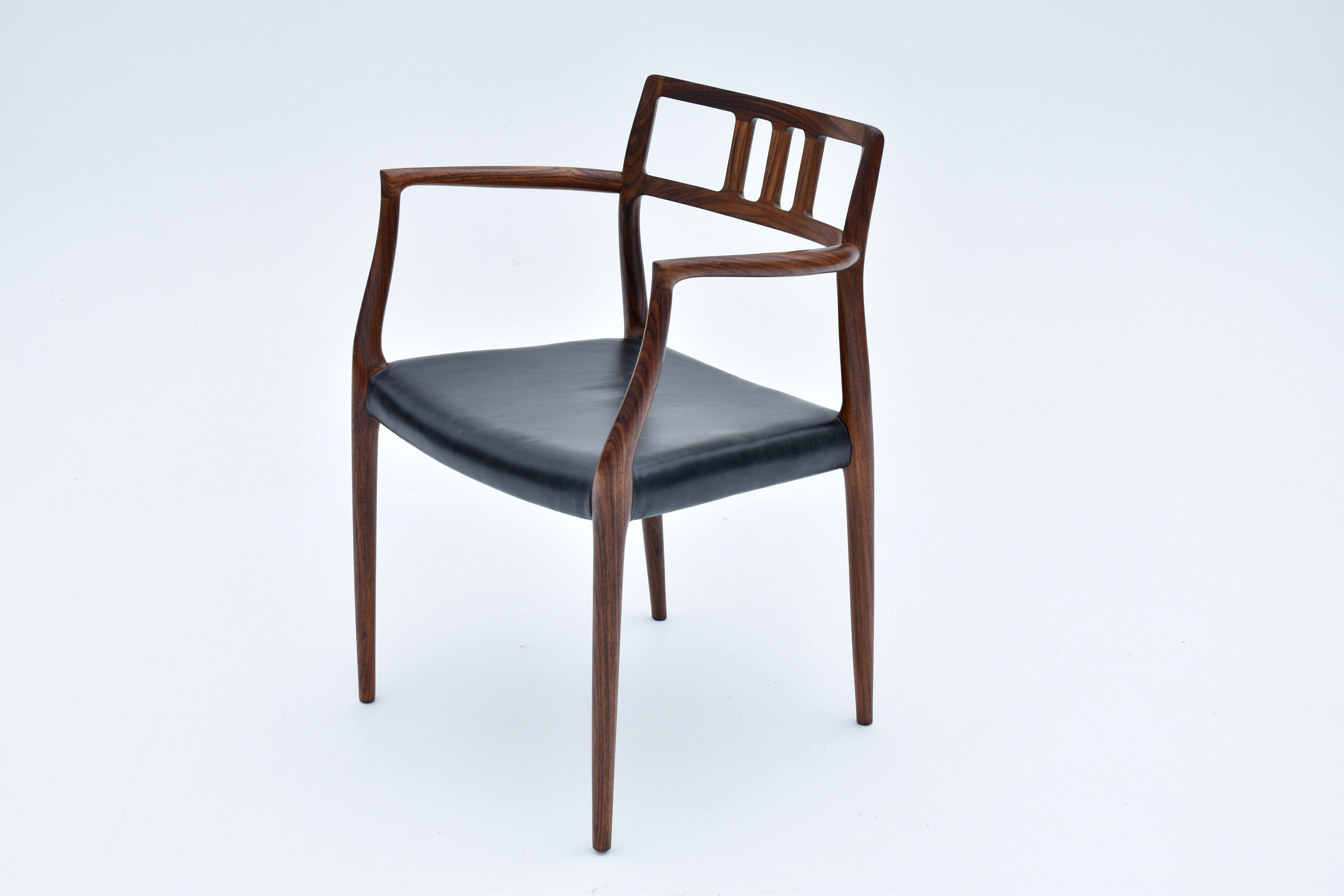 Milieu du XXe siècle Paire de fauteuils danois du milieu du siècle en palissandre modèle 64 de Niels Møller, 1966 en vente