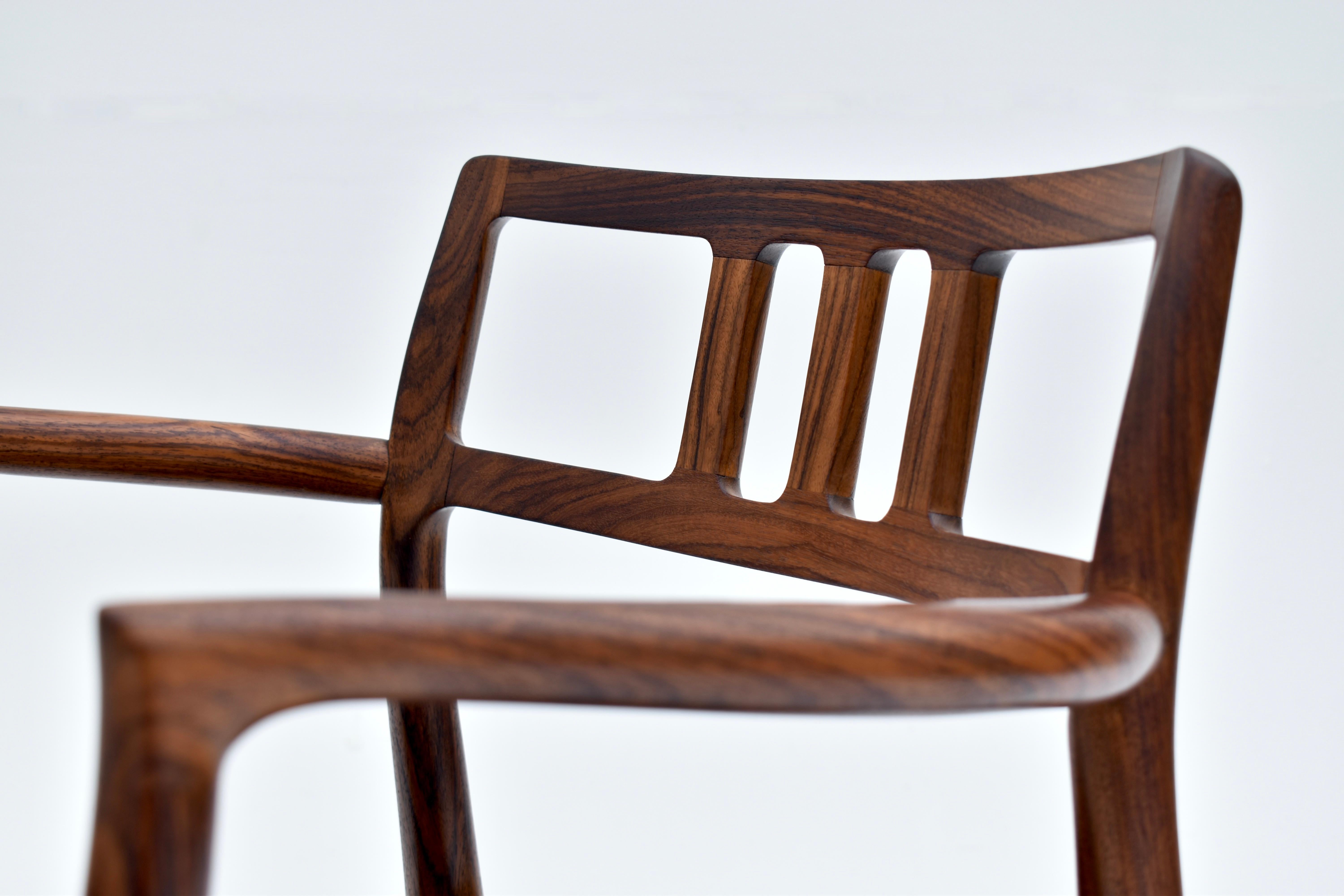 Cuir Paire de fauteuils danois du milieu du siècle en palissandre modèle 64 de Niels Møller, 1966 en vente