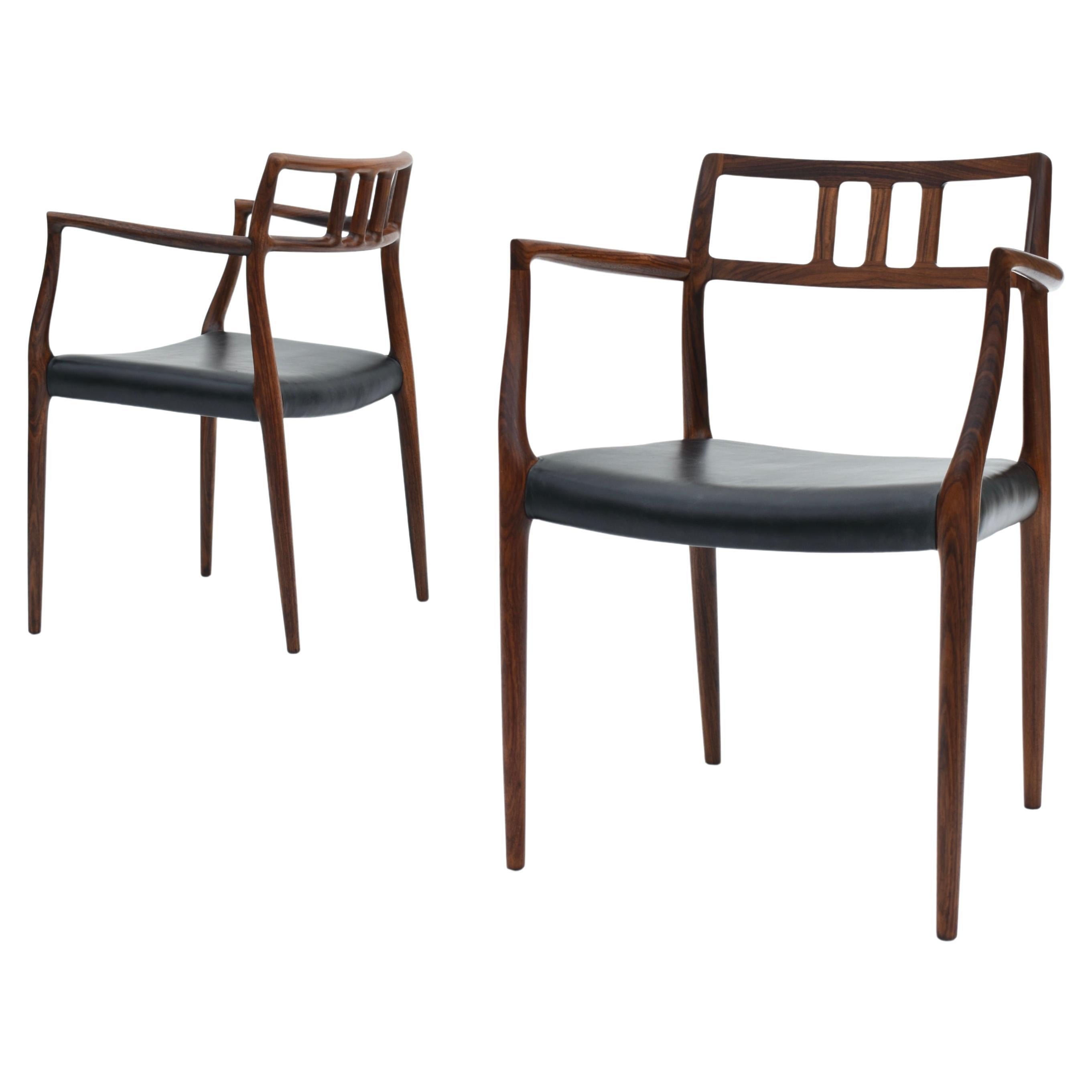 Paire de fauteuils danois du milieu du siècle en palissandre modèle 64 de Niels Møller, 1966 en vente