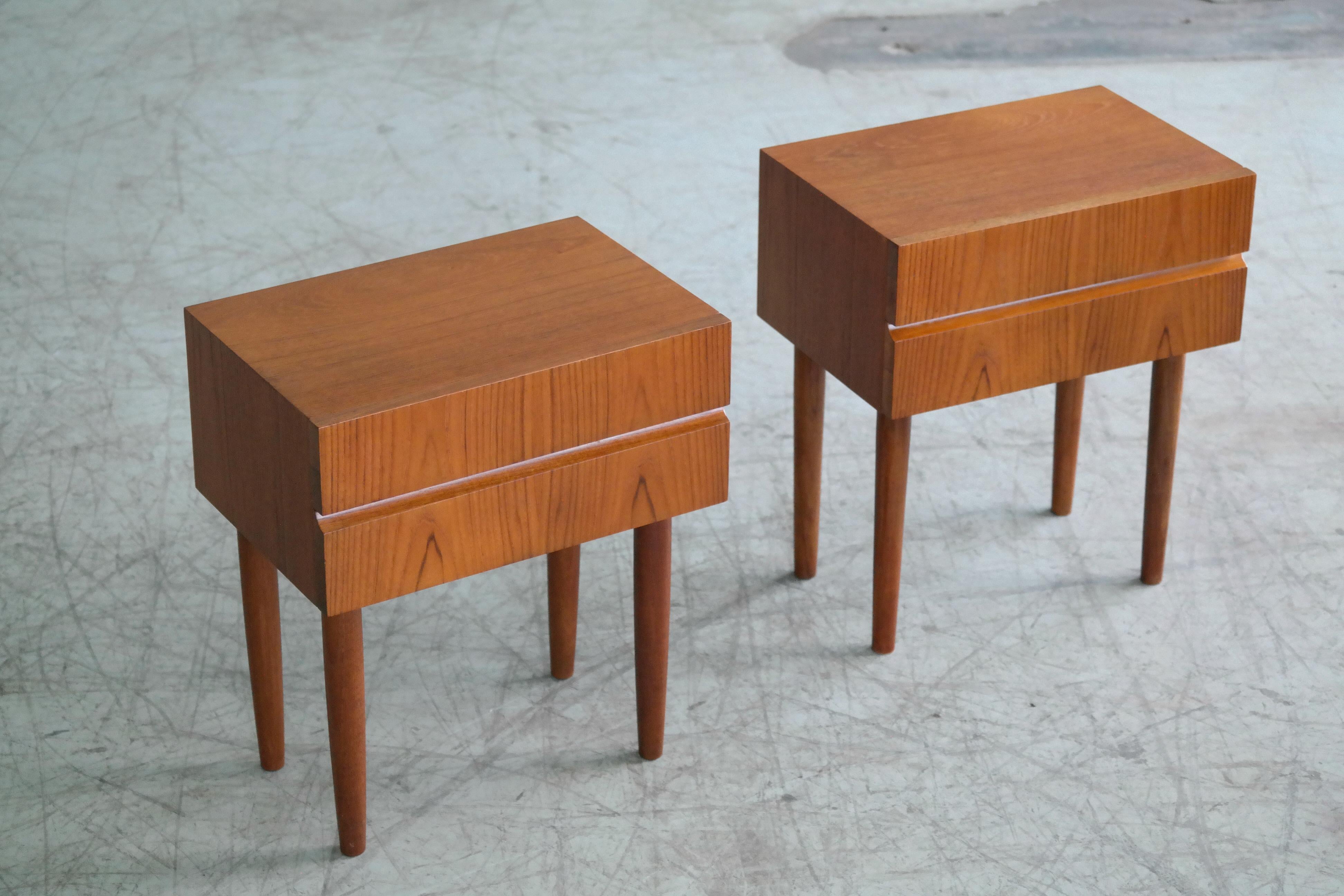 Elegant pair of small nightstands made from solid and teak veneer in Denmark the 1960s. Simple yet very refined design in the style of Ib Kofod-Larsen. Overall very good condition with nice color and grain and only minor signs of wear.