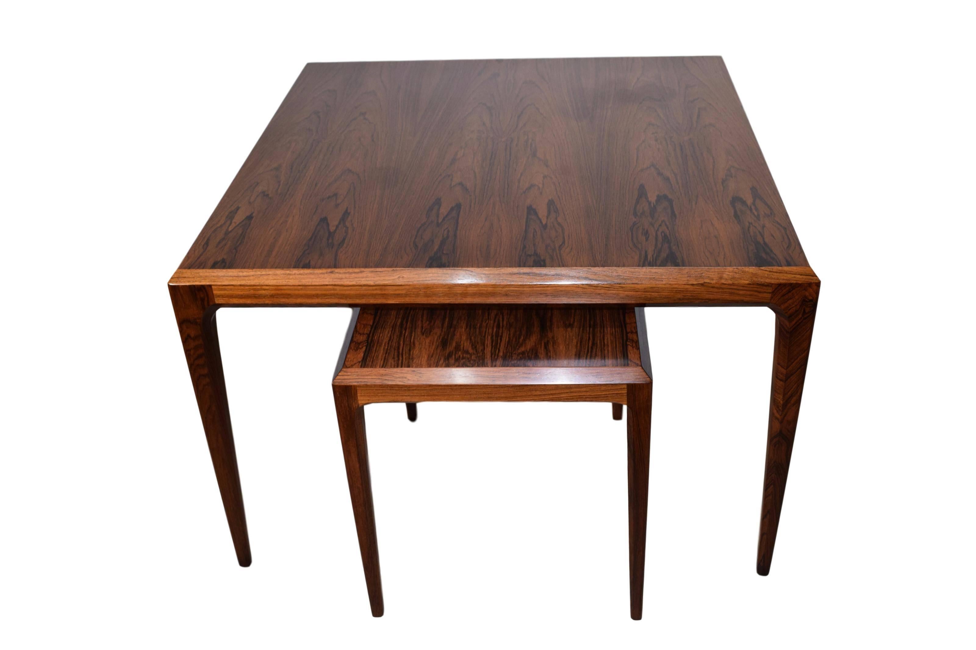 A pair of Danish midcentury rosewood tables by Johannes Andersen. Produced by CFC Silkeborg. One square coffee table and one rectangular side table. Marked by the manufacturer. 

Measures: 76 x 76 x 50 cm and 44 x 36 x 42 cm.

     