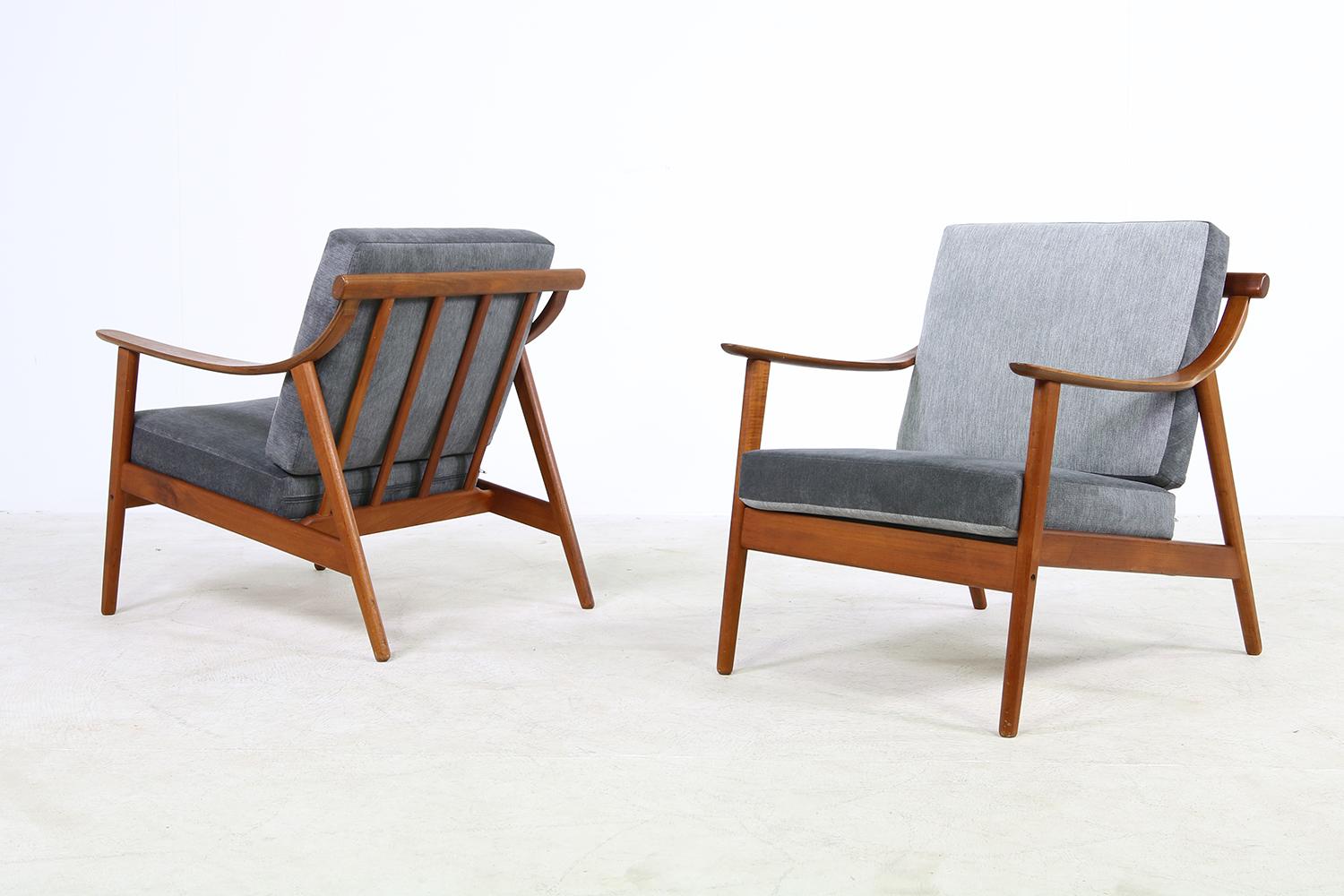 Beautiful pair of 1960s Arne Hovmand Olsen teak easy chairs, for Mogens Koch Mod. MK 119 rare pieces, Made in Denmark, new upholstery in high quality woven fabric, in dark grey and grey. Overall a fantastic condition. The seats and the back cushions