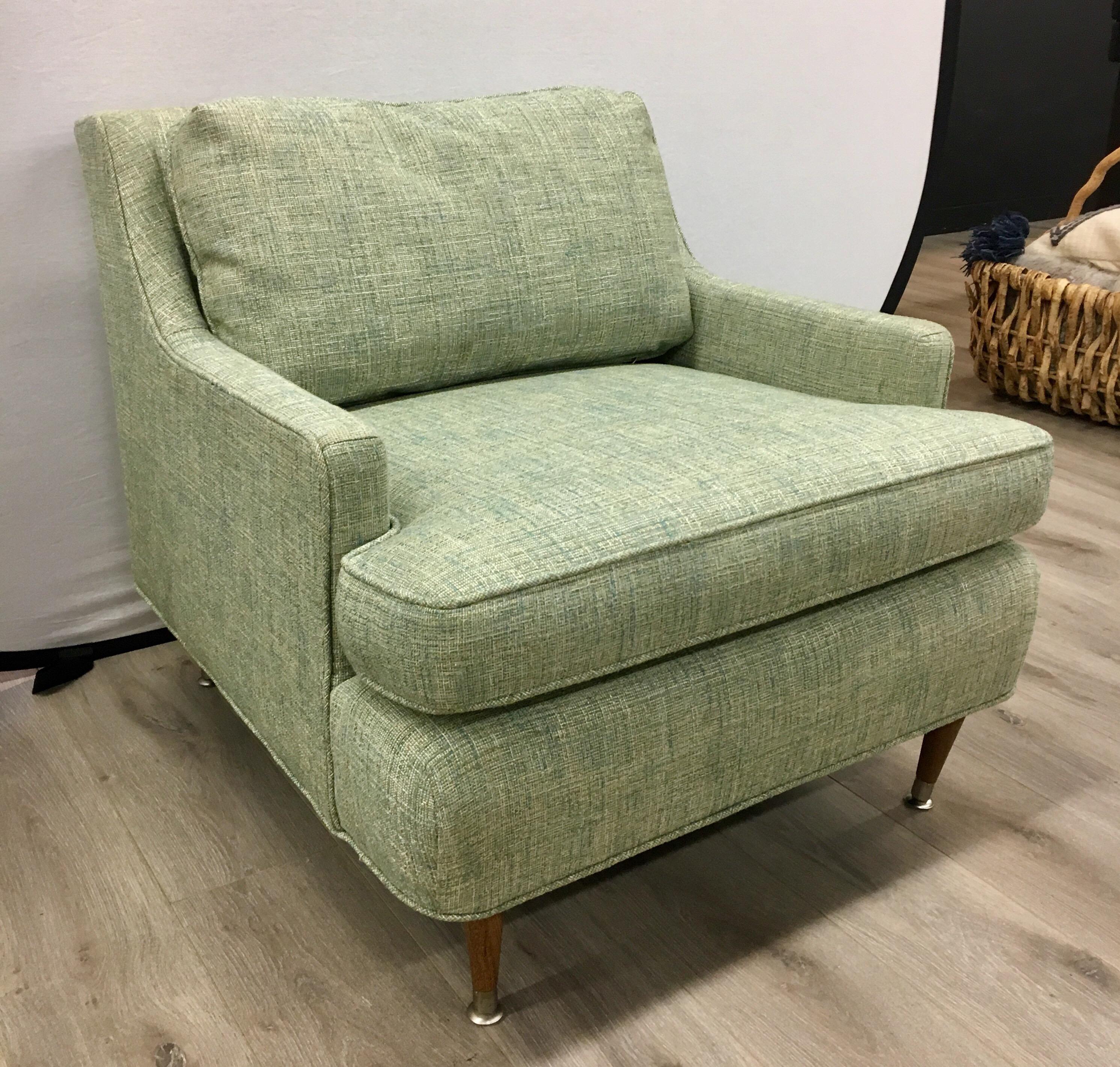 Newly reupholstered in a subtle pale green luxury fabric, these Danish modern lounge chairs from the 1970s are sure to impress.