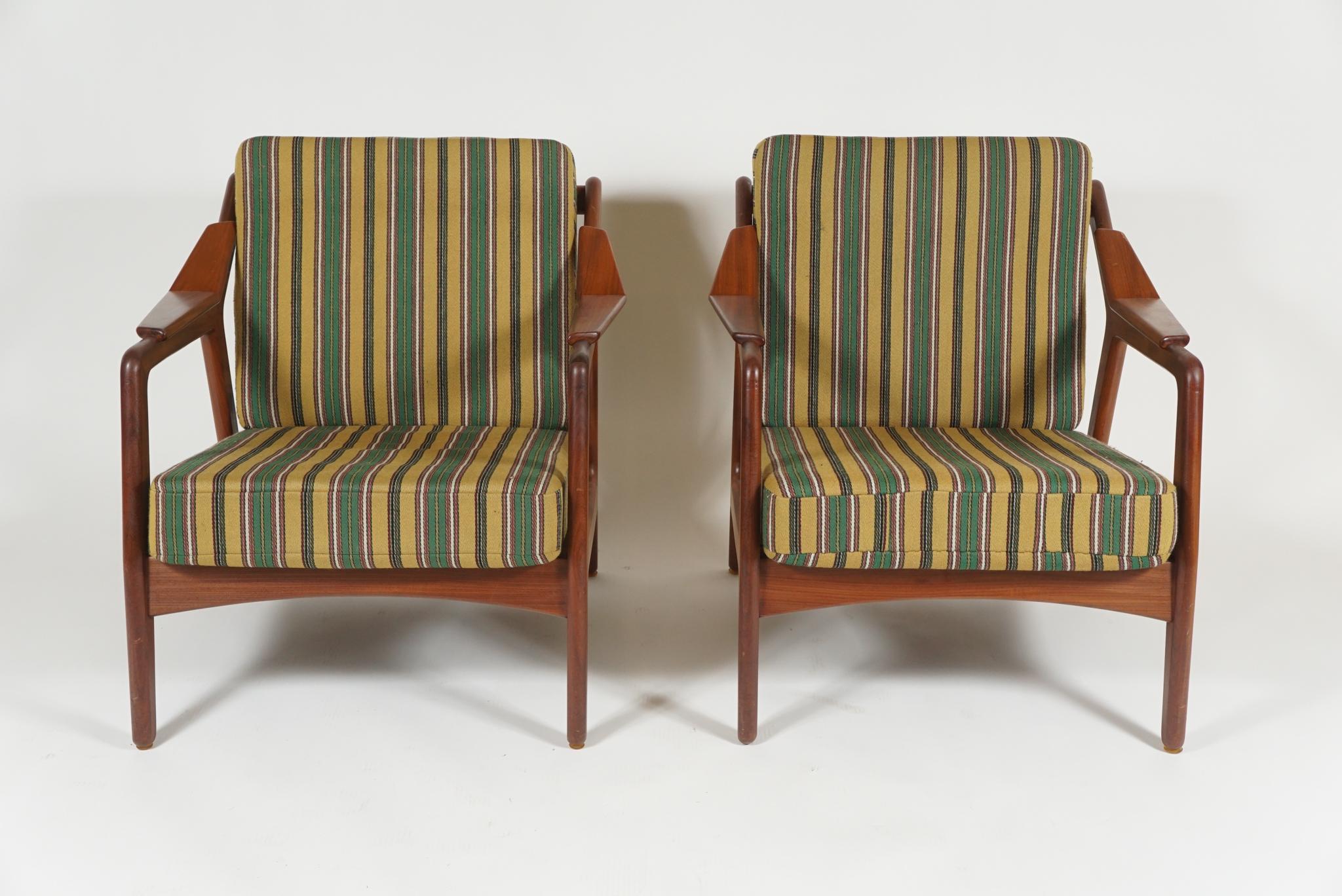A pair of armchairs by H. Brockmann Pedersen, Danish designer from 1950s, 1960s in cherry, exceptional quality with striking angled
arms a signature of Pedersen's work. Covered in original striped fabric.