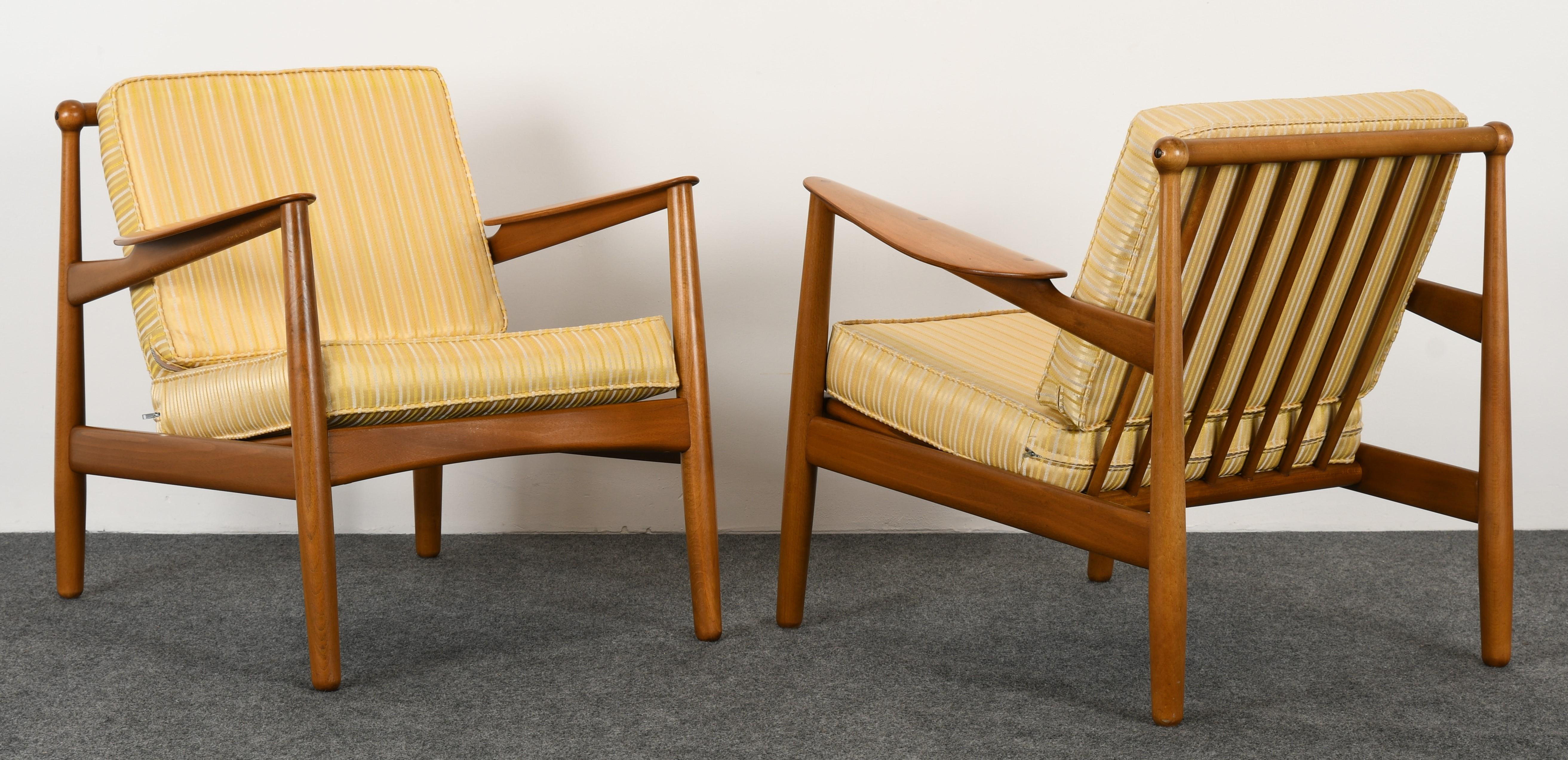 A sleek pair of Danish modern chairs by P. Jeppesen. This particular model is nearly identical to the Easy Chair model 401 by Arne Hovmand-Olsen, although there are slight differences in design, both chairs were manufactured by the same company.