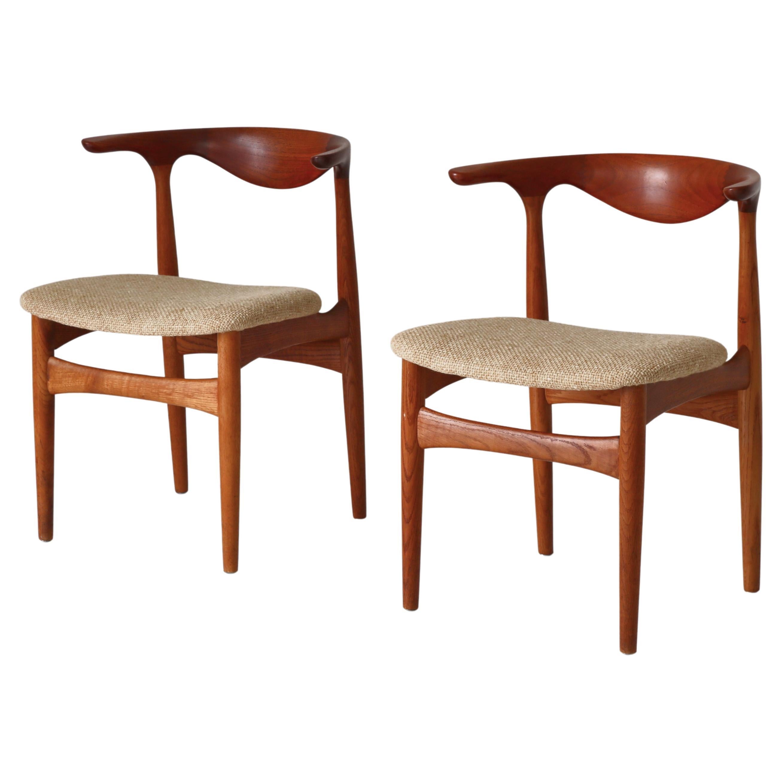 Paire de fauteuils modernes danois ""Cowhorn"". Knud Færch en teck et chêne, années 1960