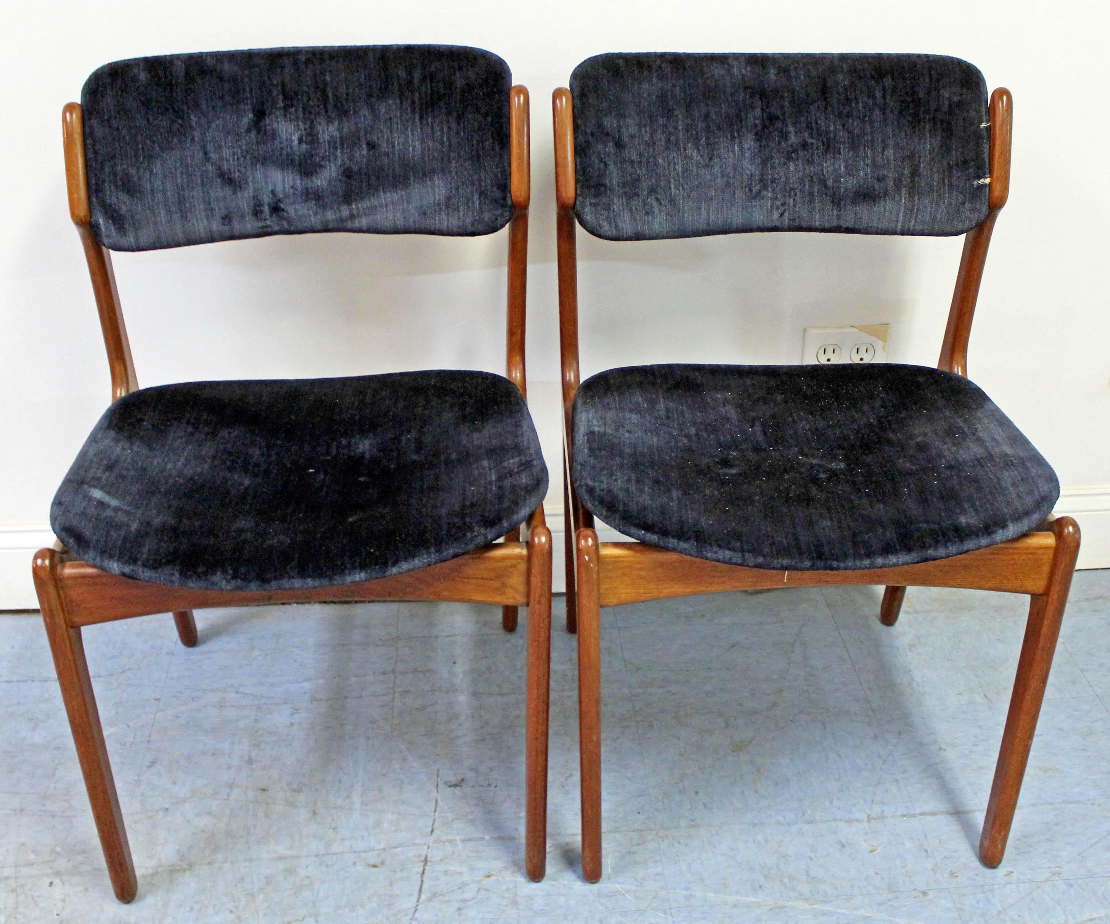 Offered is a pair of Danish modern Model 49 dining chairs by Erik Buch for O.D. Mobler. Includes two teak side chairs with elegant lines and floating seats with velvet-type upholstery. They're in decent vintage condition with normal age wear