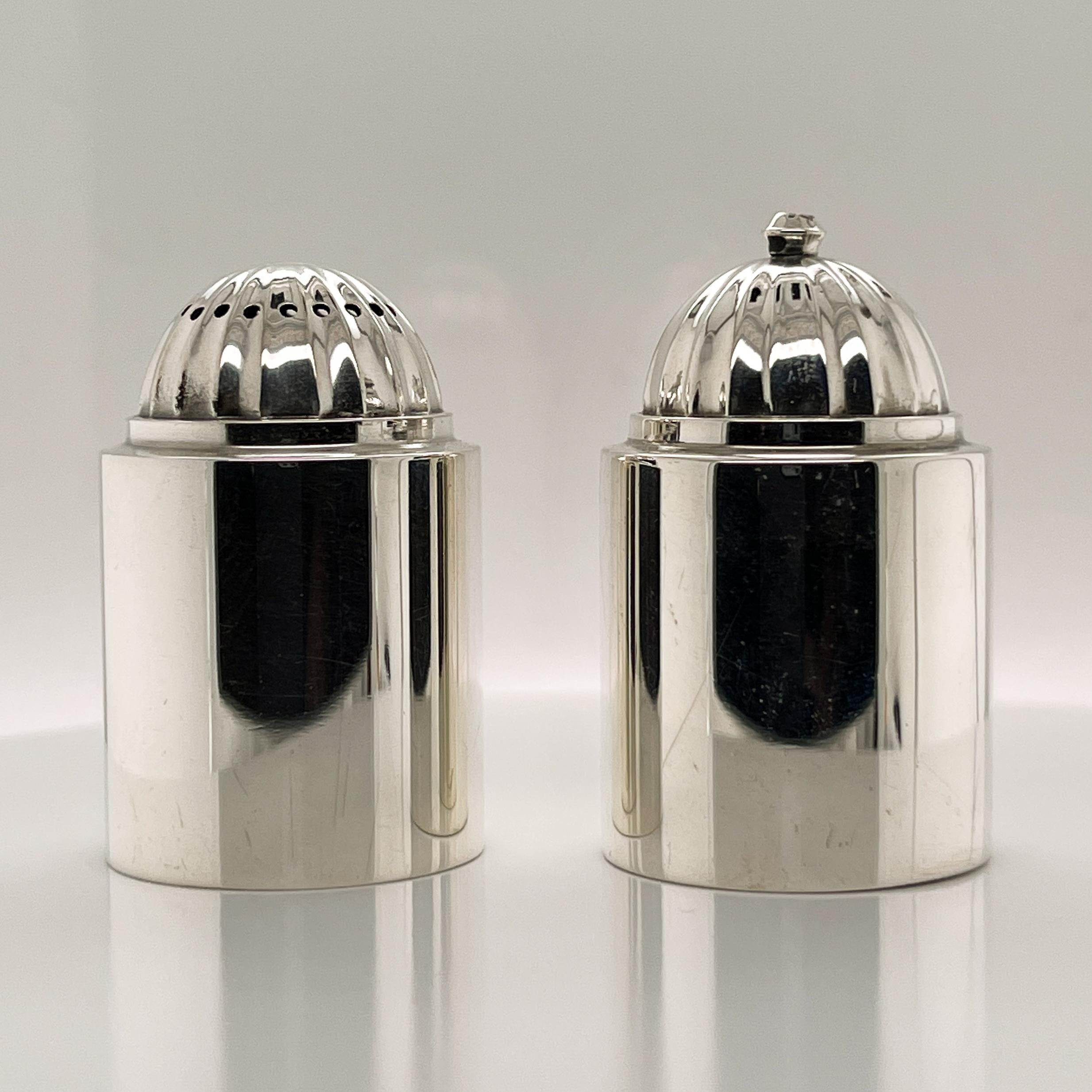 A rare pair of Georg Jensen sterling silver salt and pepper shakers.

Model No. 627. 

Designed by Ove Brobeck. 

A rare and fine pair!

Date:
20th Century

Overall Condition:
They are in overall good, as-pictured, used estate condition with some