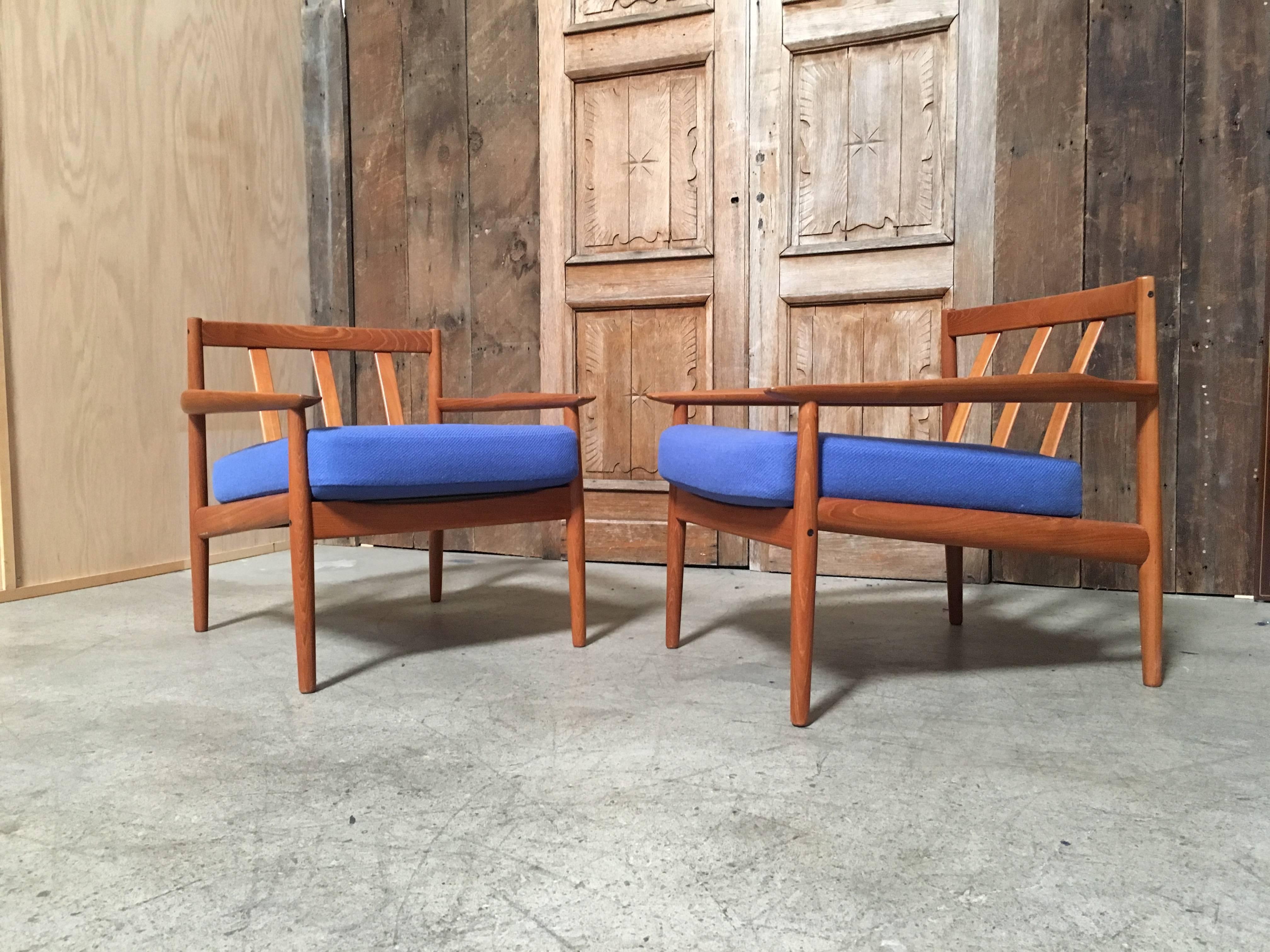 Solid teak armchairs with new fabric and foam by Arne Vodder.