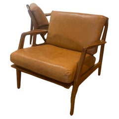 Pair of Danish Modern Lounge Chairs by Ib Kofod-Larsen in Leather 
Walnut