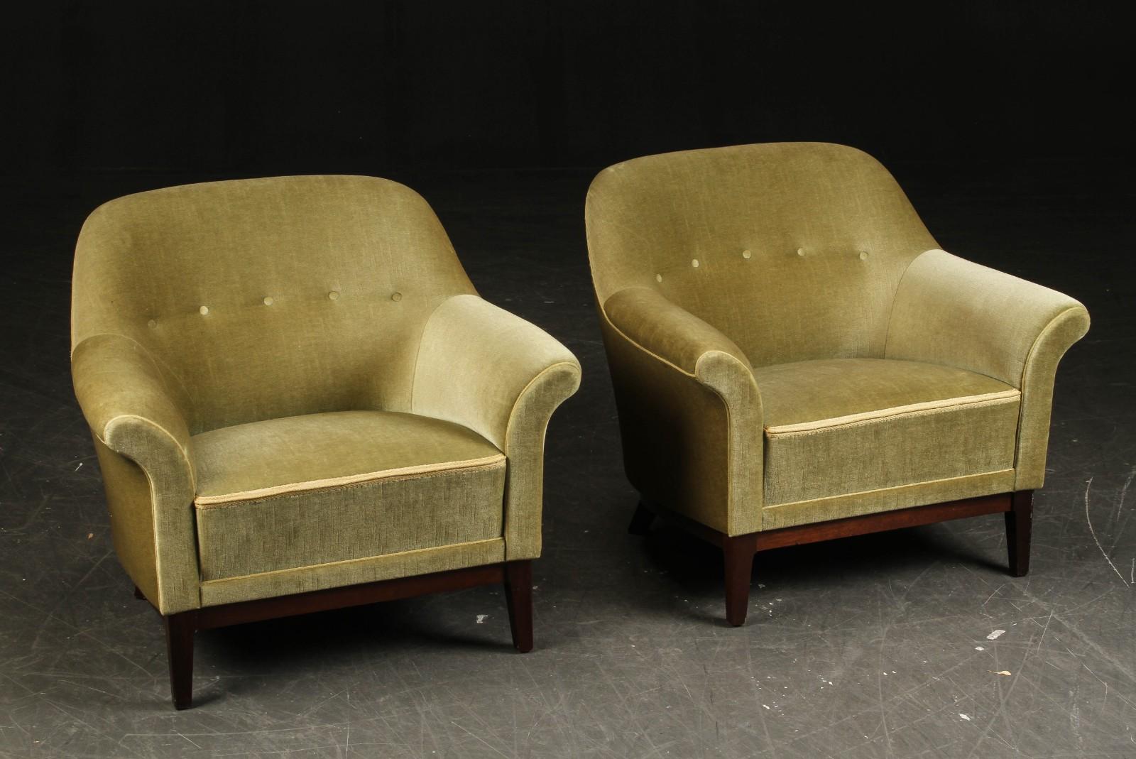 Pair of Danish Modern lounge chairs with mahogany legs upholstered in a green velour fabric. 
Well built and comfortable with elegant form.
  