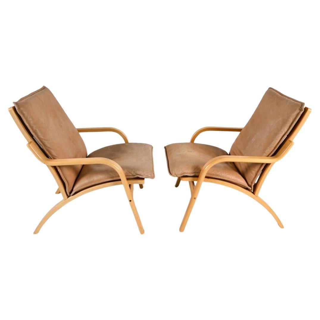 Scandinavian Modern Pair of Danish Modern lounge chairs in bent beech wood and tan leather by Stouby For Sale