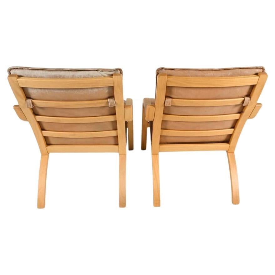Woodwork Pair of Danish Modern lounge chairs in bent beech wood and tan leather by Stouby For Sale