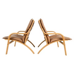 Vintage Pair of Danish Modern lounge chairs in bent beech wood and tan leather by Stouby