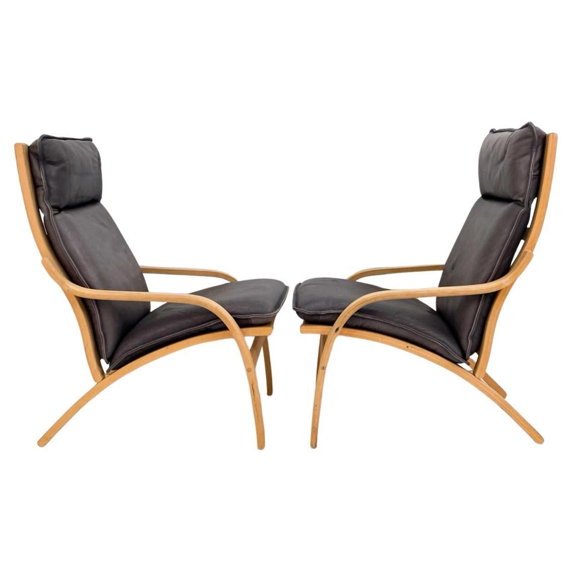 Pair of Danish Modern lounge chairs in bent beech wood and gray leather. These chairs have Stouby liner fabric under cushions. Possibly designed by Mogens Hansen for Stouby. Denmark Circa 1980's.

Sold as a pair (2) chairs

 Dimensions: H 33