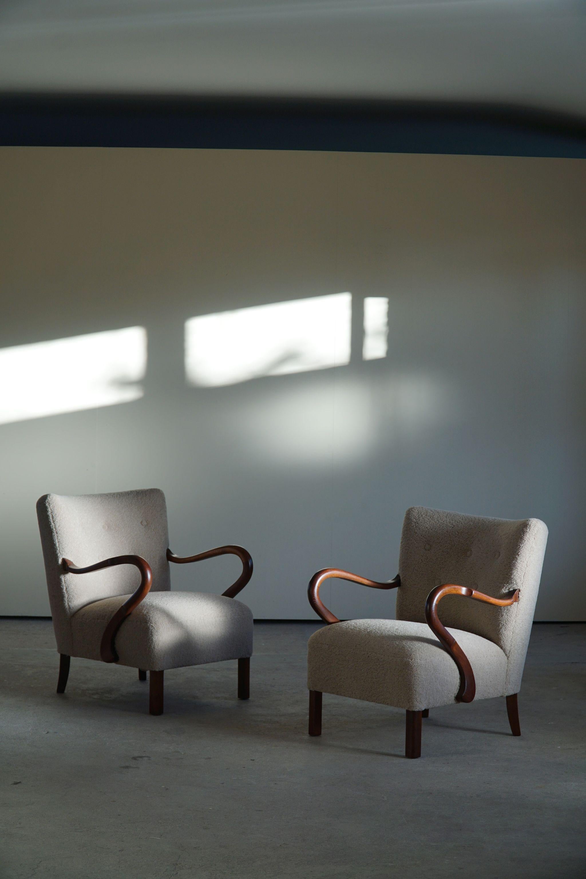 A pair of low back Danish Lounge chairs, reupholstered with bouclé ish wool, armrest and legs in stained oak. Made by Alfred Christensen in 1940s.

This sculptural mid century pair is in excellent vintage condition.

Other designers worth to