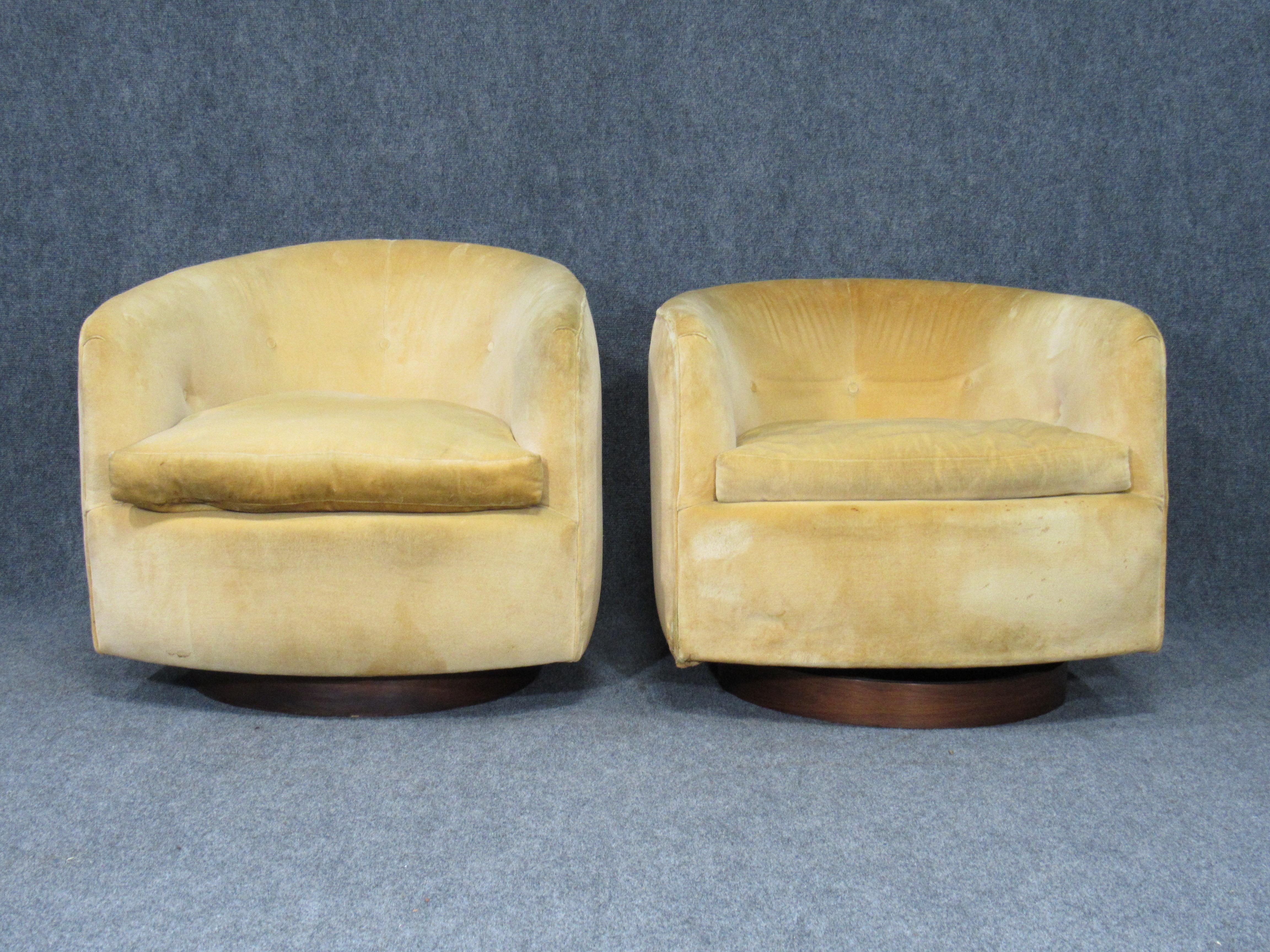 Pair of Danish modern Milo Baughman style swivel club chairs with teak bases. Upholstered in original gold velvet fabric.