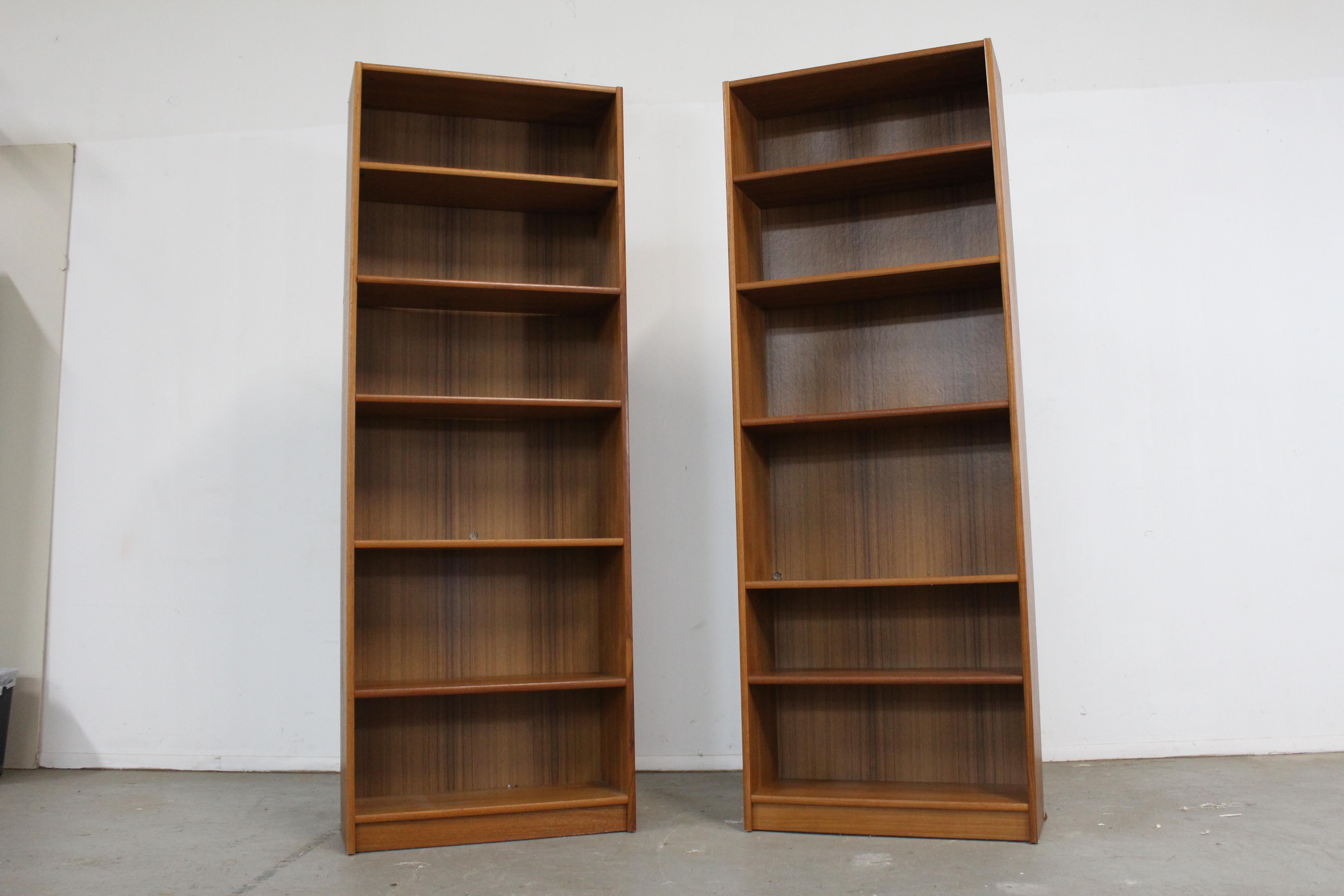 air of Mid-Century Danish Modern Mobler Teak bookcase/shelf

Offered is a pair of Danish modern teak bookcase. These teak bookcases feature adjustable shelves. In good vintage condition, has some surface scratches, wear, and 3- 1