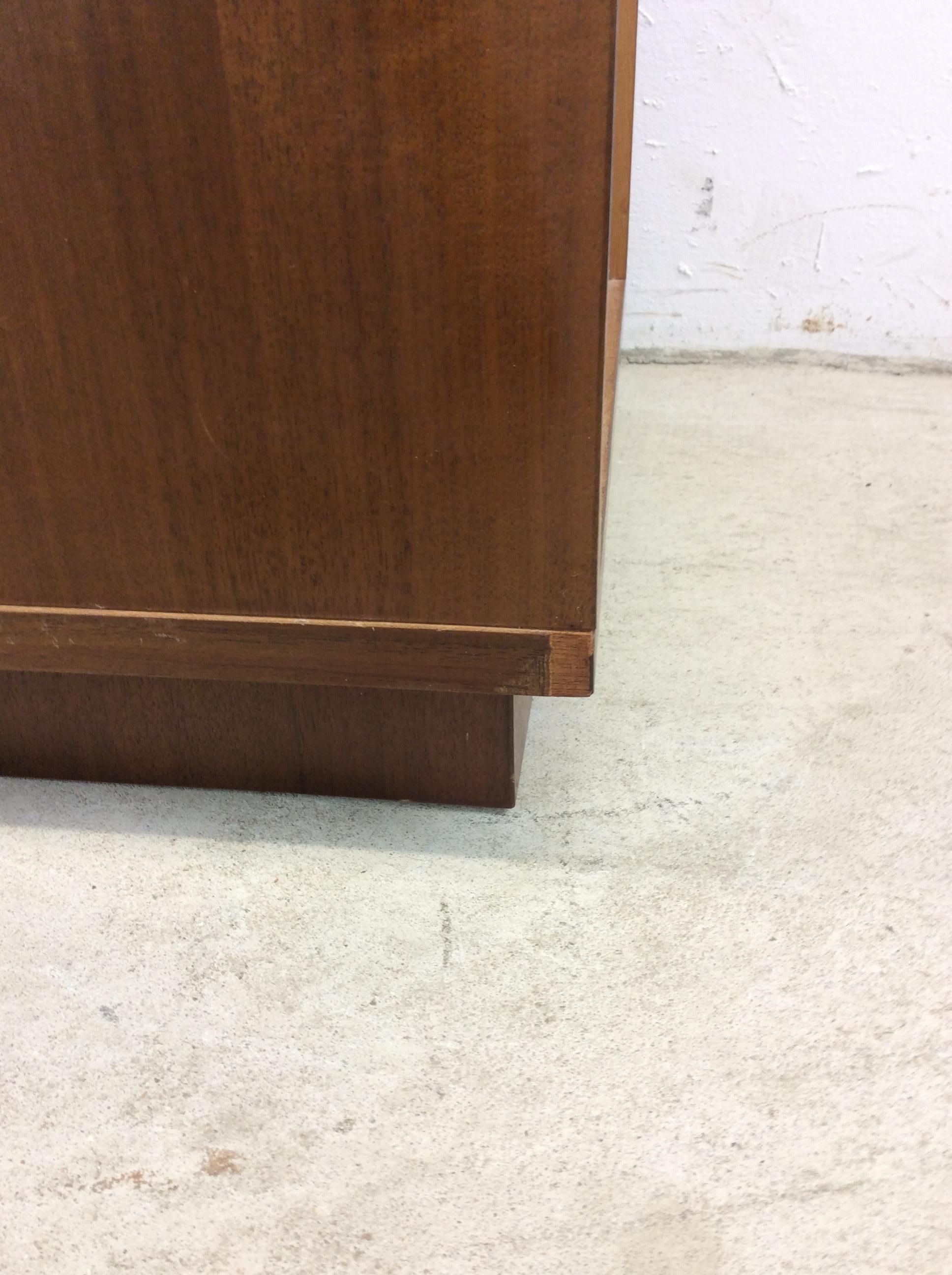 This pair of Danish modern end tables feature pressed wood construction, beautiful teak veneer with original finish, carved wood cabinet pulls, and finished backs.

Please be sure to check out our other Danish modern furniture