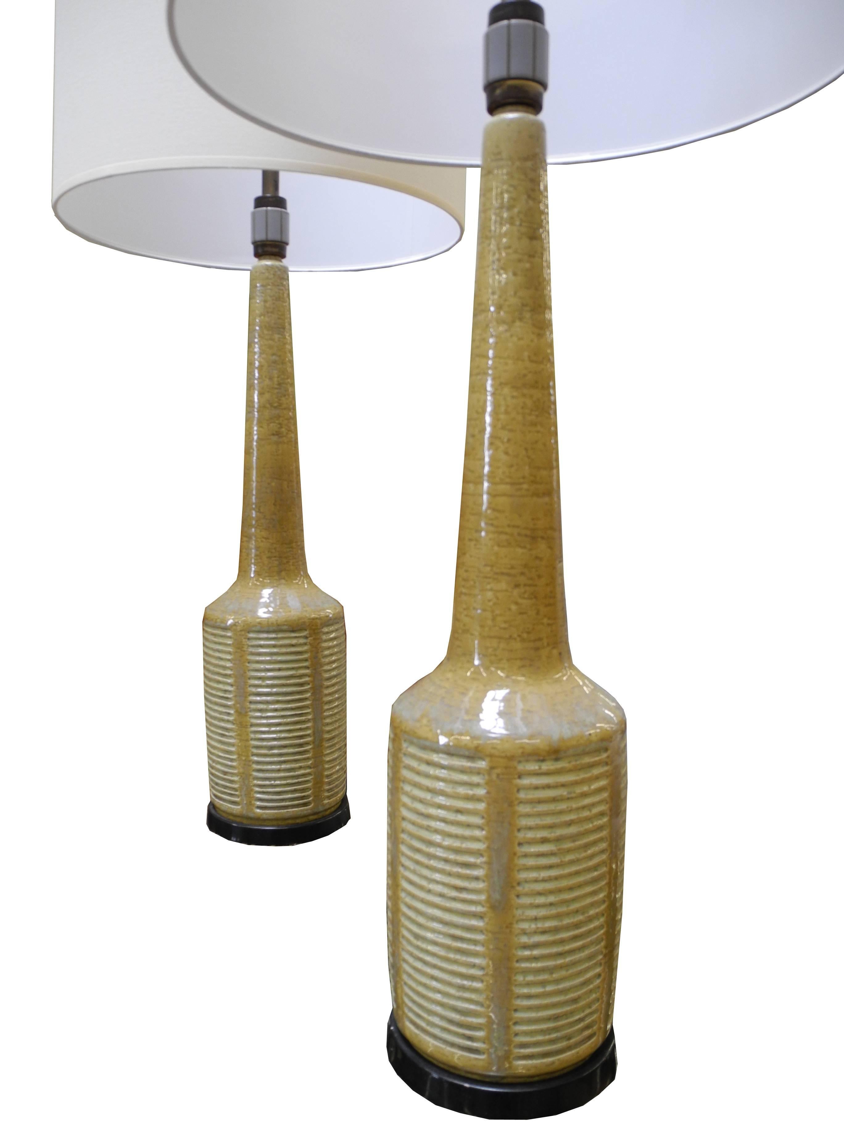 These ceramic lamps were made by Palshus ceramic of Denmark for Hansen Lighting.
    