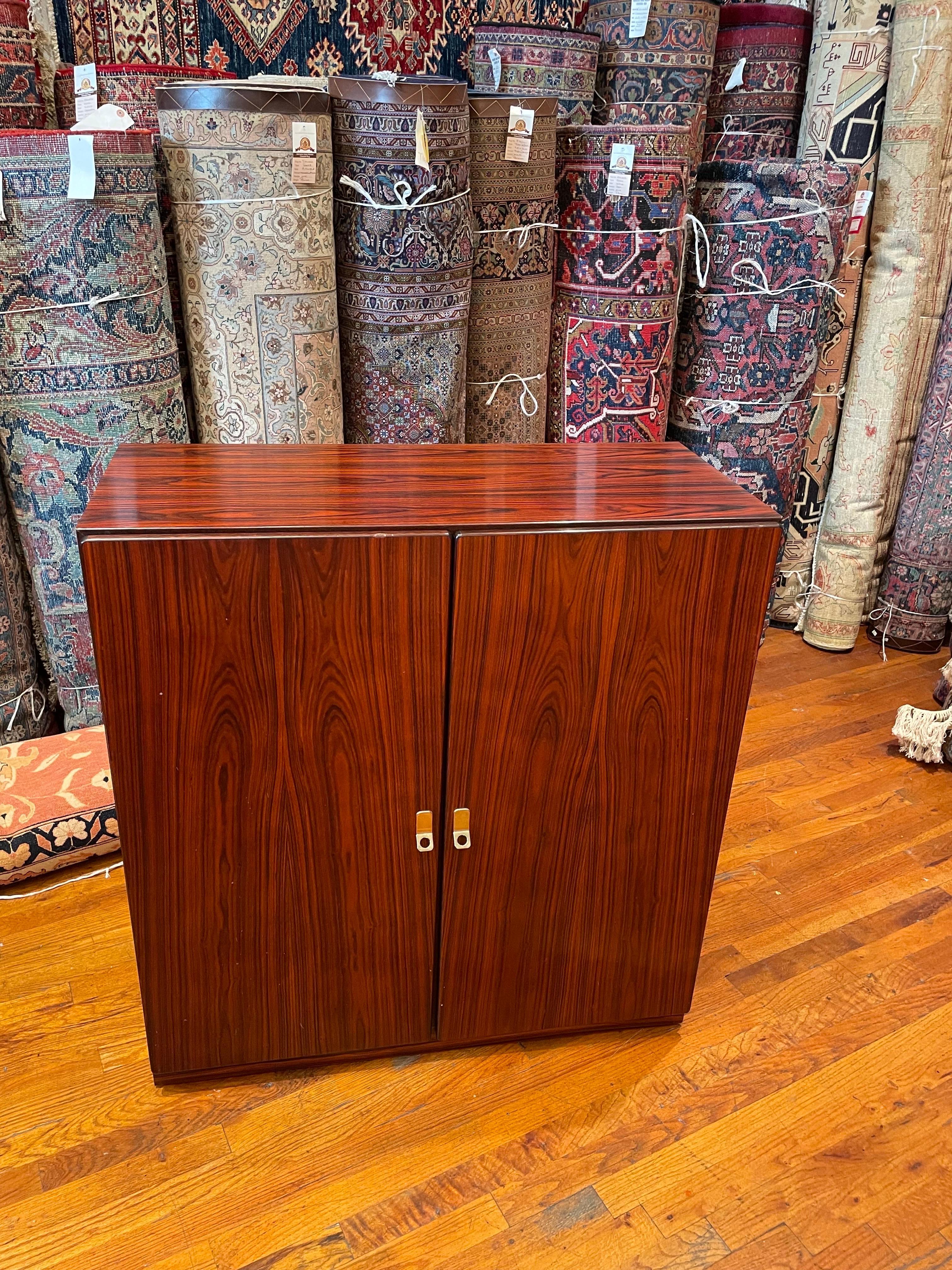 Great pair of versatile Danish modern rosewood cabinets circa 1980's, great size and very clean original condition, nice polished brass handles, the buyer has the option to buy 1 or 2.