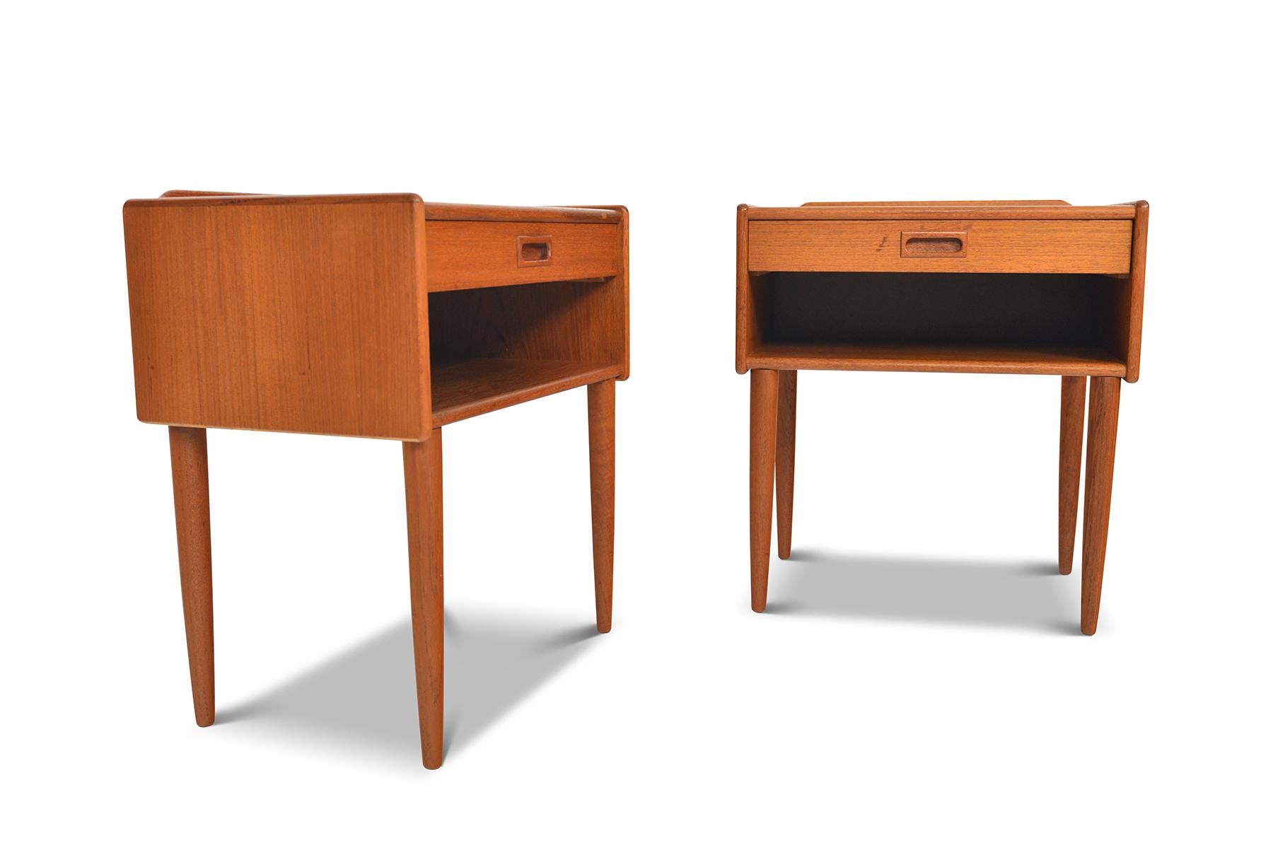 This handsome pair of Danish modern midcentury nightstands blend form and function seamlessly. A single pullout drawer provides storage for smaller items with a roomy open cubby beneath. In excellent original condition with typical wear for their