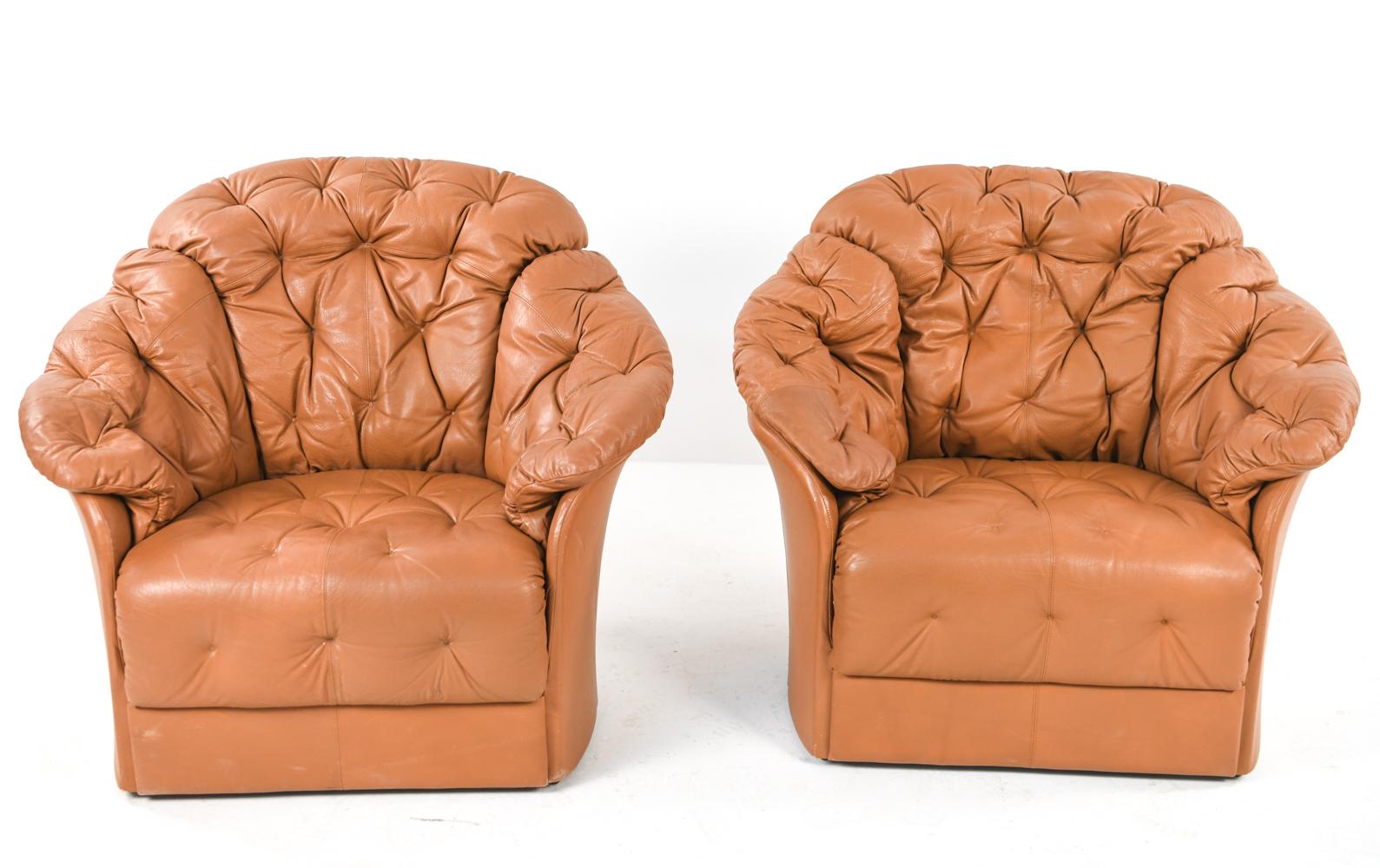 A rare pair of Skipper Mobler Danish modern over-stuffed tufted cognac leather lounge chairs epitomizing comfort. With Skipper Furniture label underneath.
