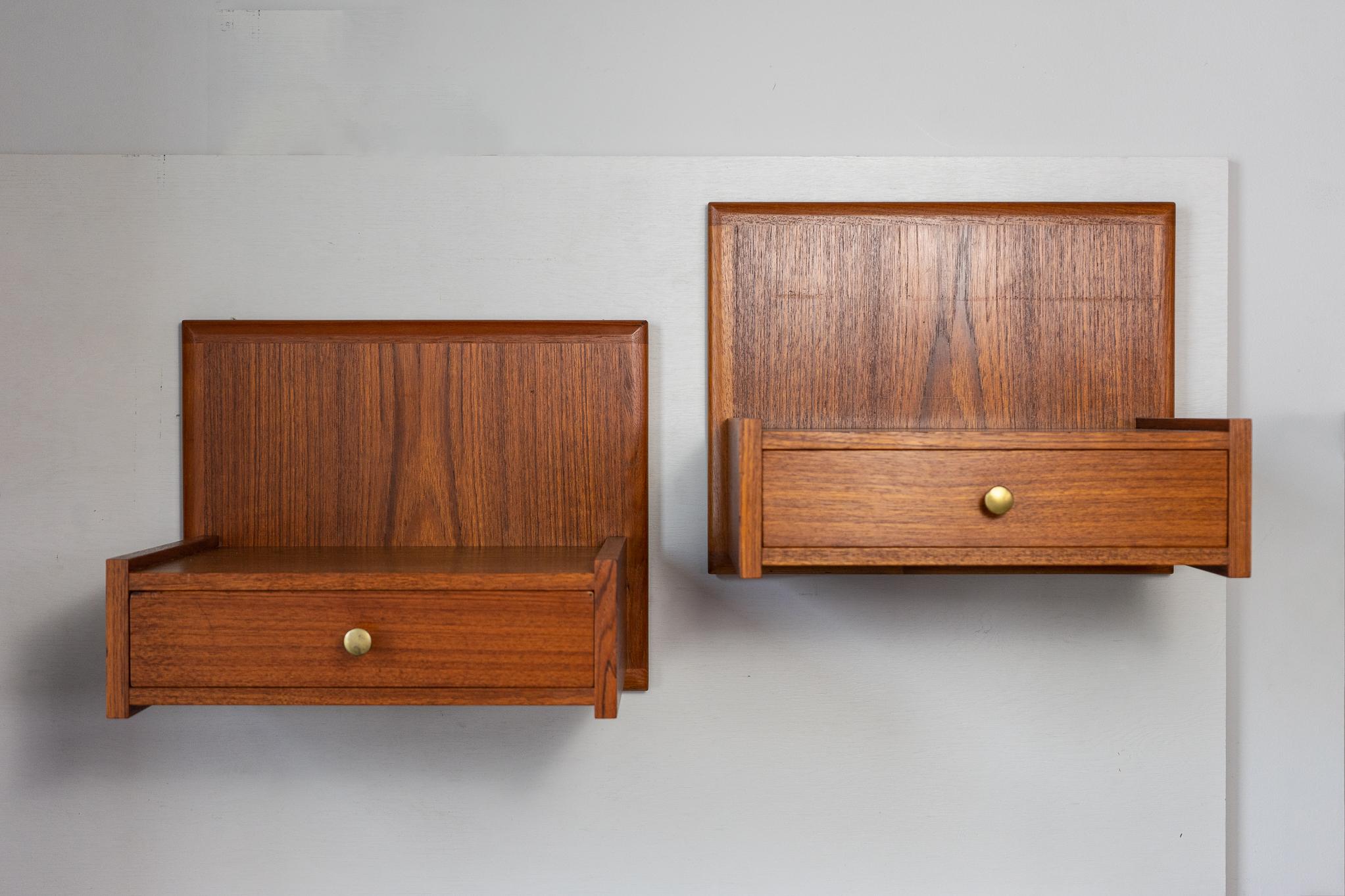 Teak Danish modern floating bedside tables, circa 1960's. Slim, sleek drawers offer storage for small items, top surface can support a nice lamp. Solid wood framing surrounds expertly matched veneer on the top and sides. Would also make excellent