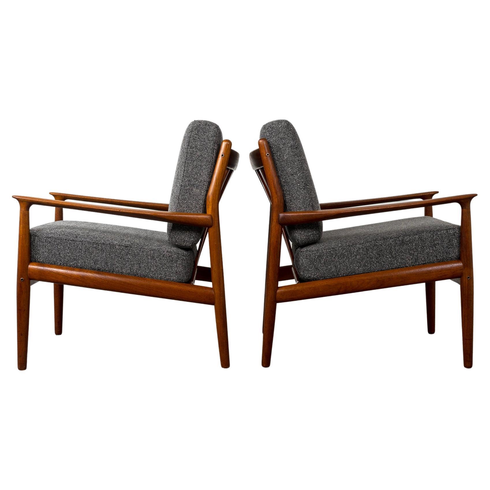 Teak Danish modern pair of exceptional lounge chairs by Svend Erikson, circa 1960's. Sultry sculpted teak frames with beautiful smooth joinery and slatted backs. Absolutely gorgeous from every angle. Excellent construction and quality, new foam and