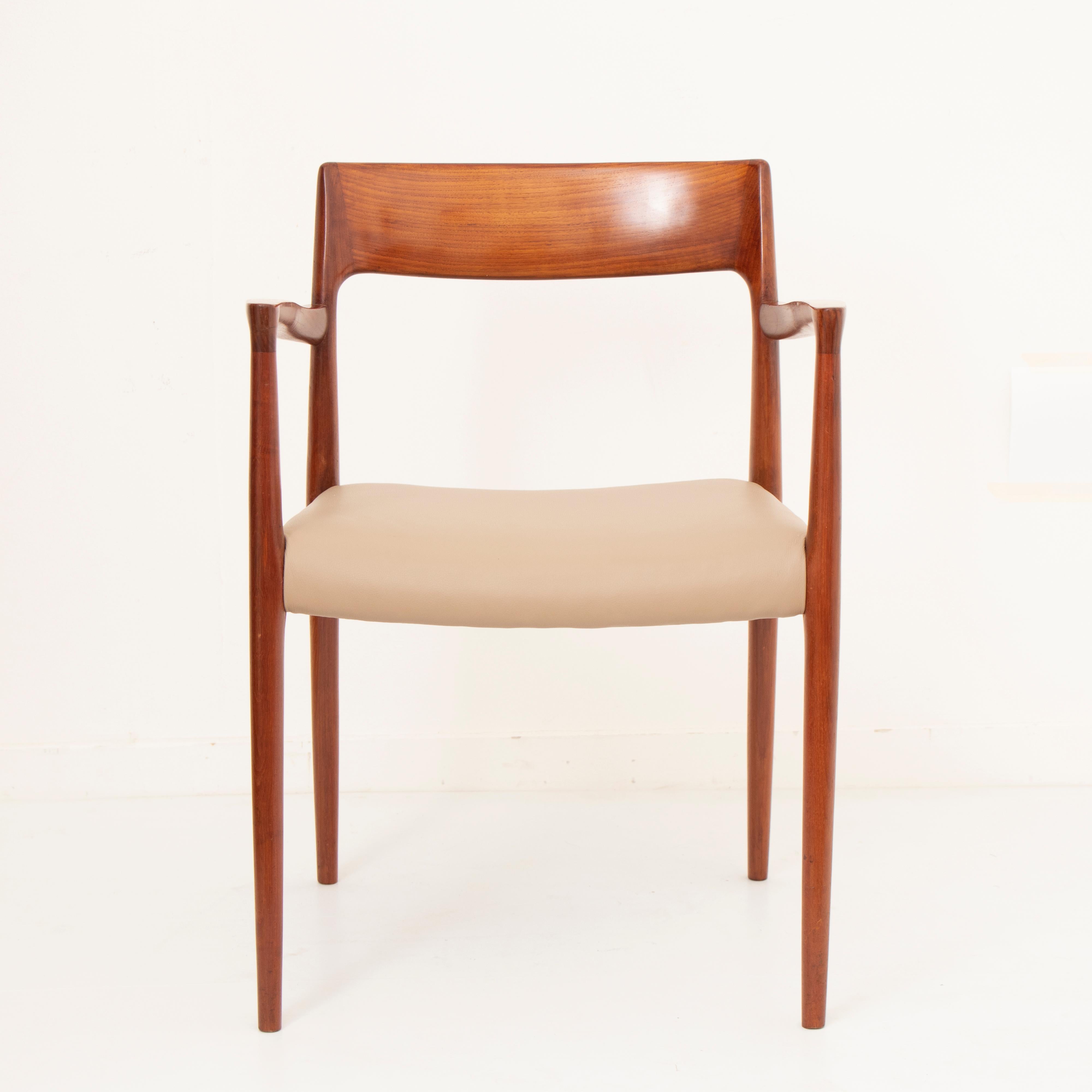 A pair of 1950s Niels O Møller model 57 teak carver armchair dining chairs. The seats have been reupholstered with a supple Italian tan leather. The chairs were designed by Niels Otto Møller and manufactured by J.L Møllers Møbelfabrik in Denmark.
